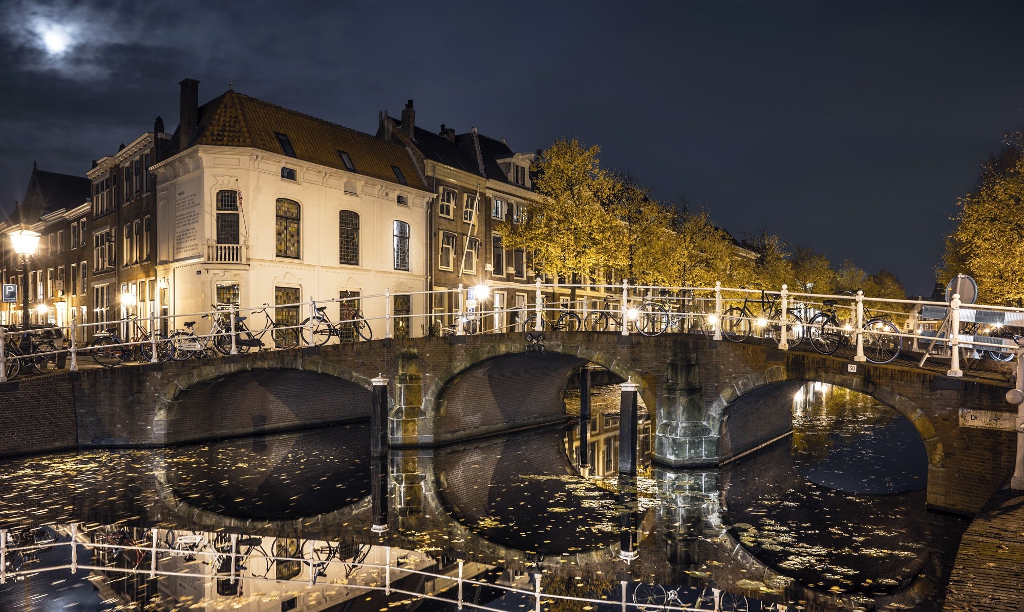 Night view of a canal bridge in a European city HD Wallpaper