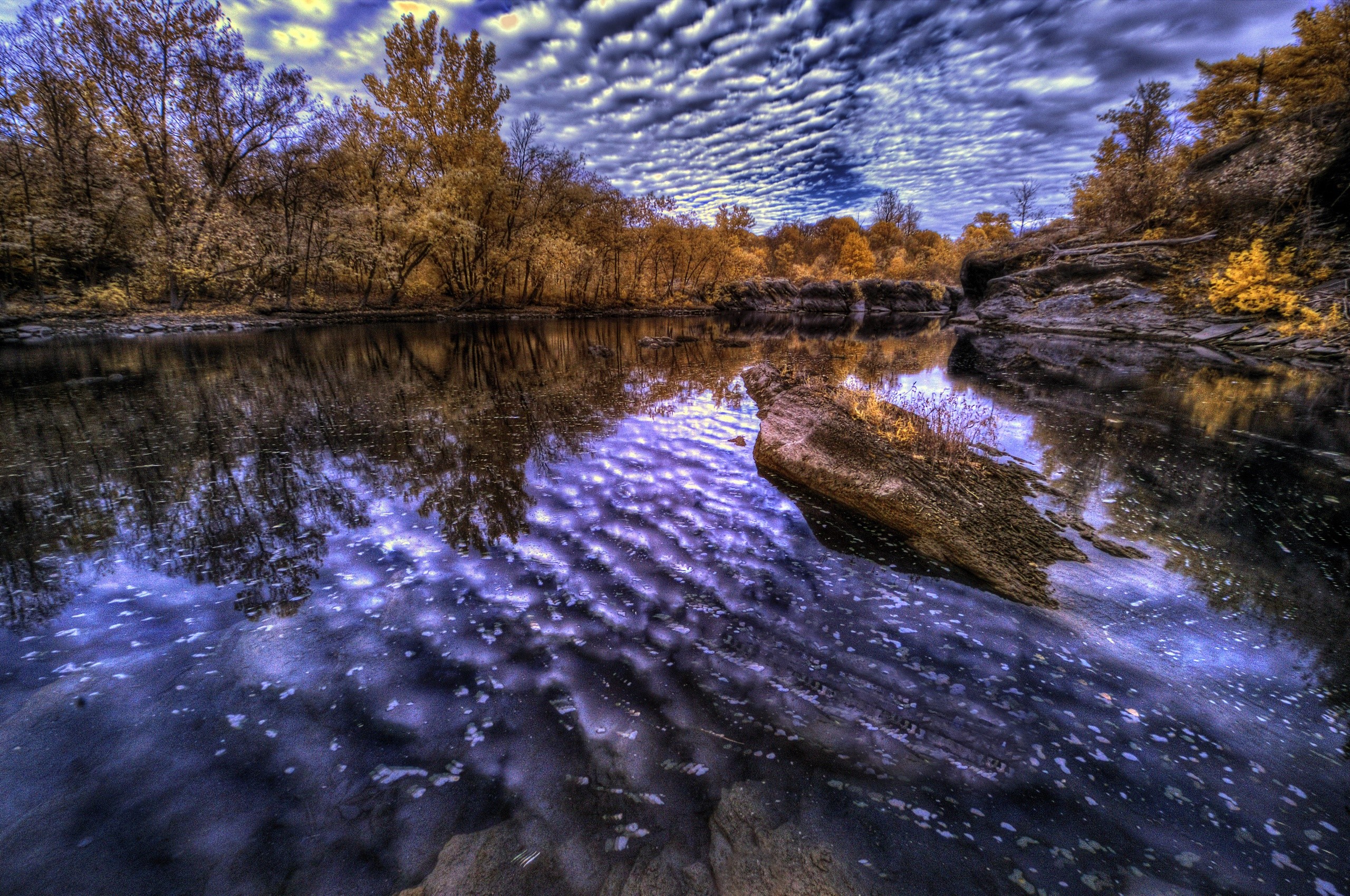 River reflecting trees and sky in fall HD Wallpaper