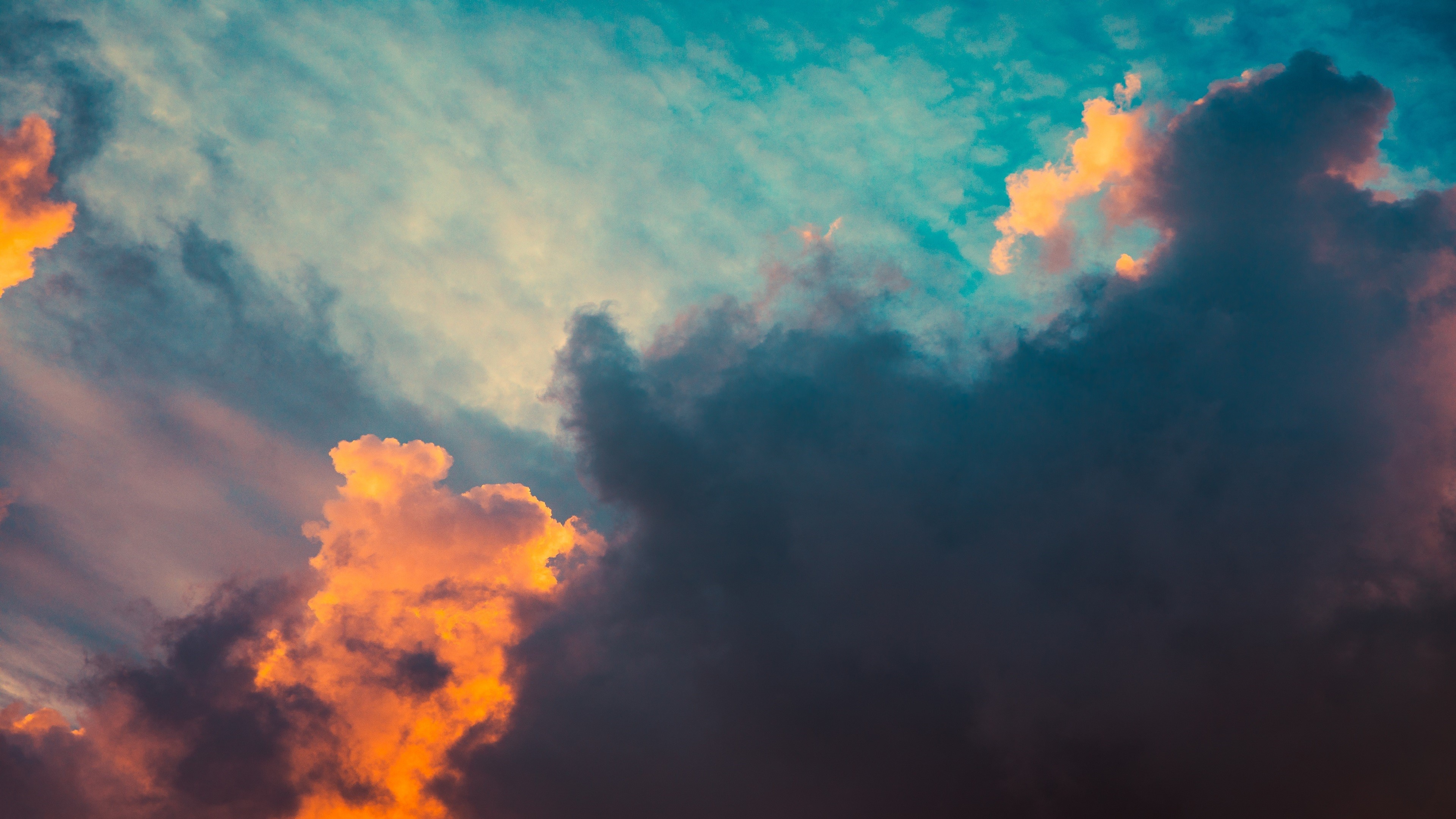 Dark clouds with orange and blue sky HD Wallpaper