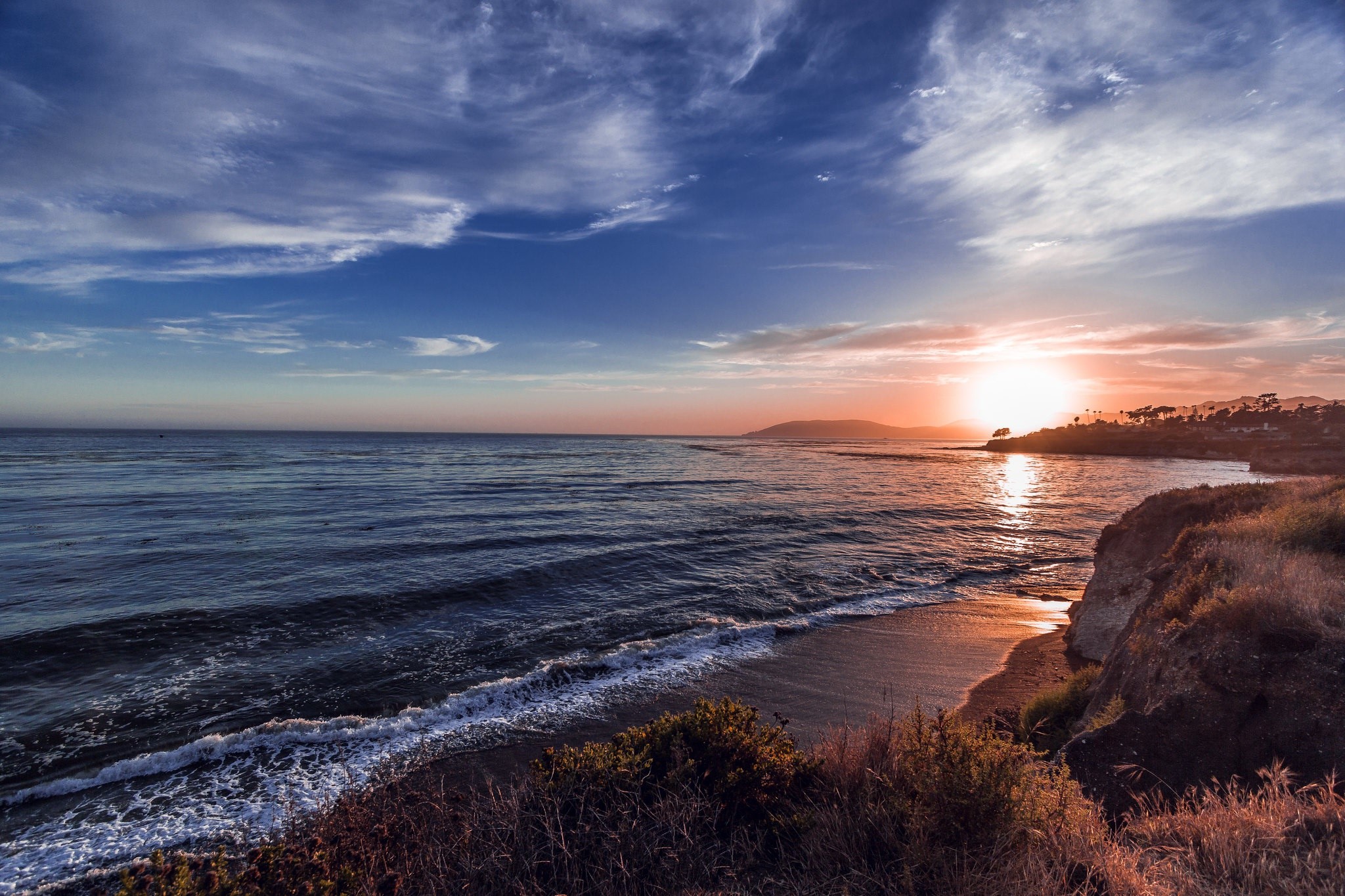 Sunset over the ocean coast with dramatic clouds HD Wallpaper