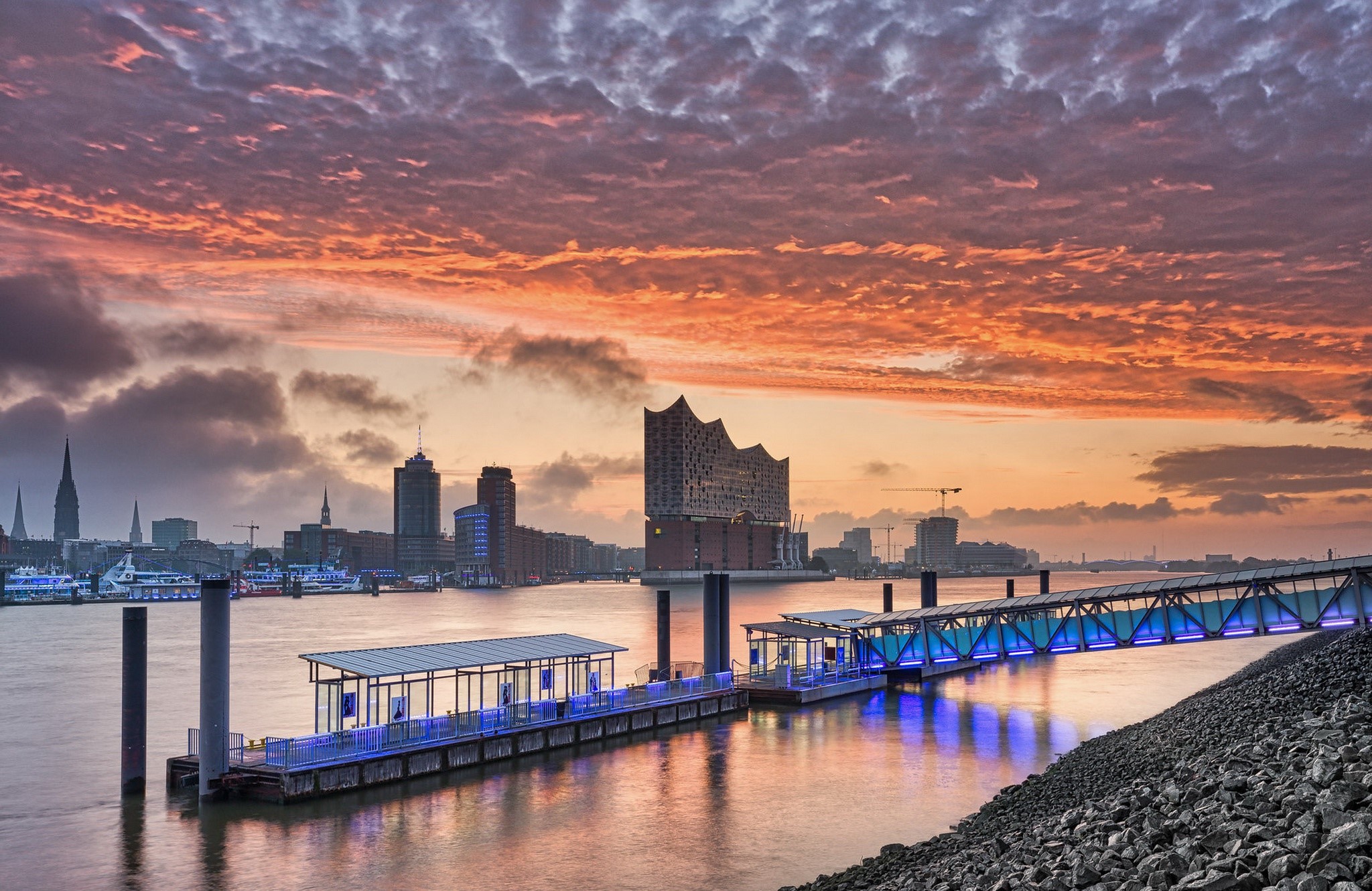 Hamburg cityscape with Elbe river and harbor at sunset HD Wallpaper