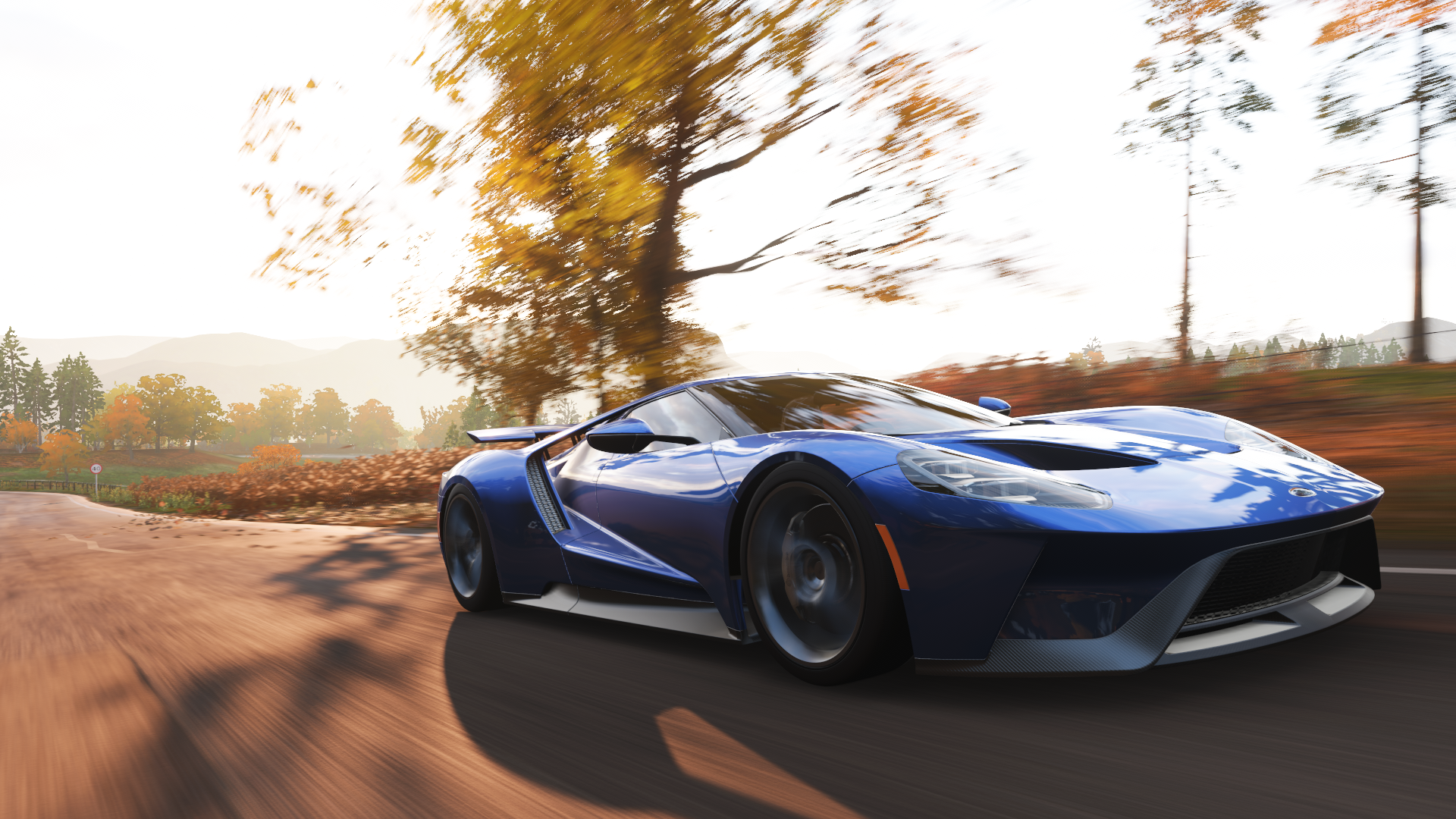 Blue Ford GT driving on a road in Forza Horizon 4 HD Wallpaper