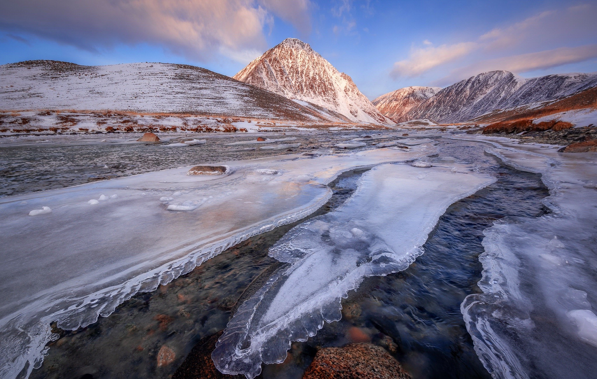 Winter landscape with icy river and snow-capped mountains in Mongolia HD Wallpaper