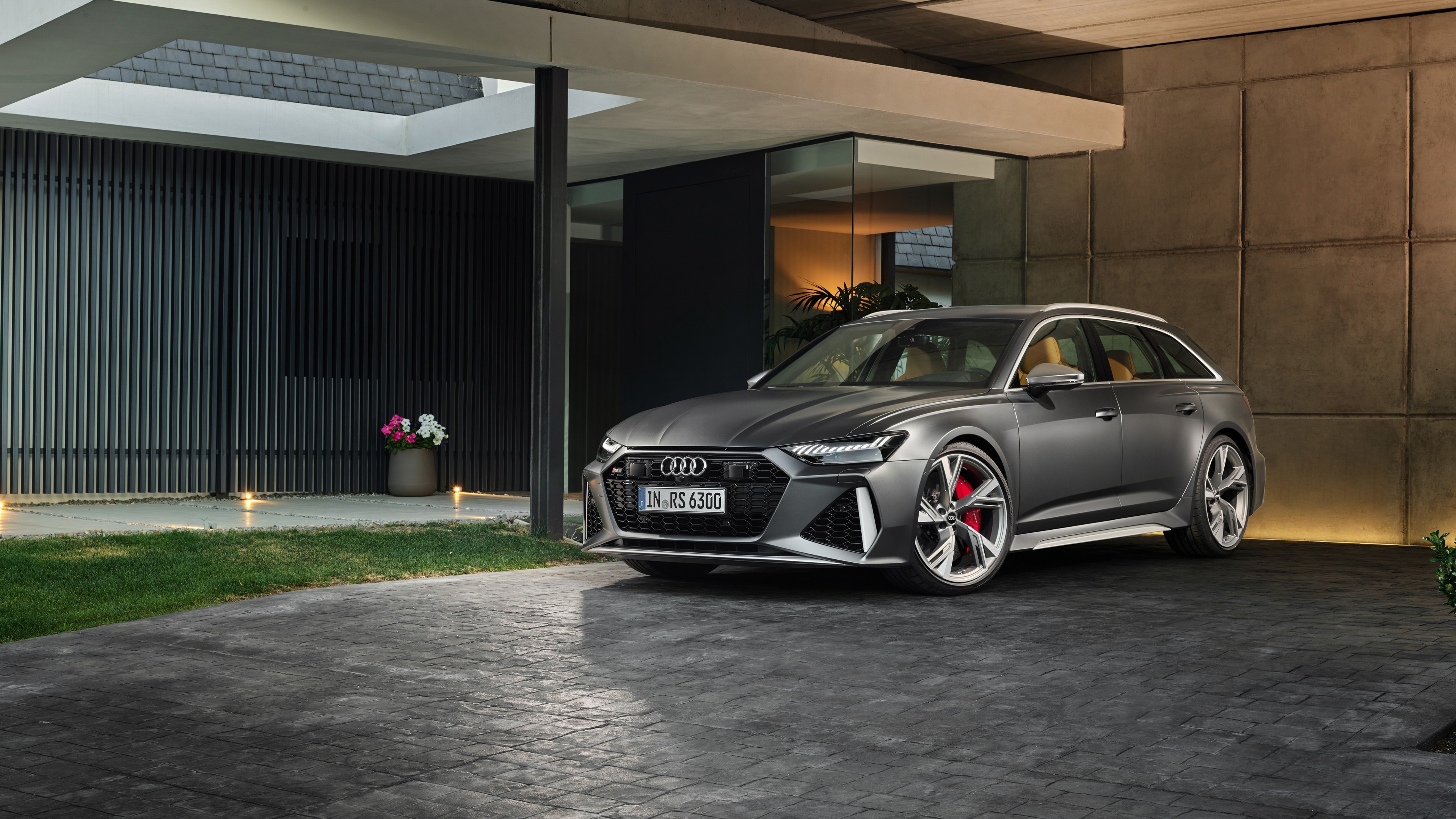 Audi RS6 Avant parked in front of a modern house HD Wallpaper