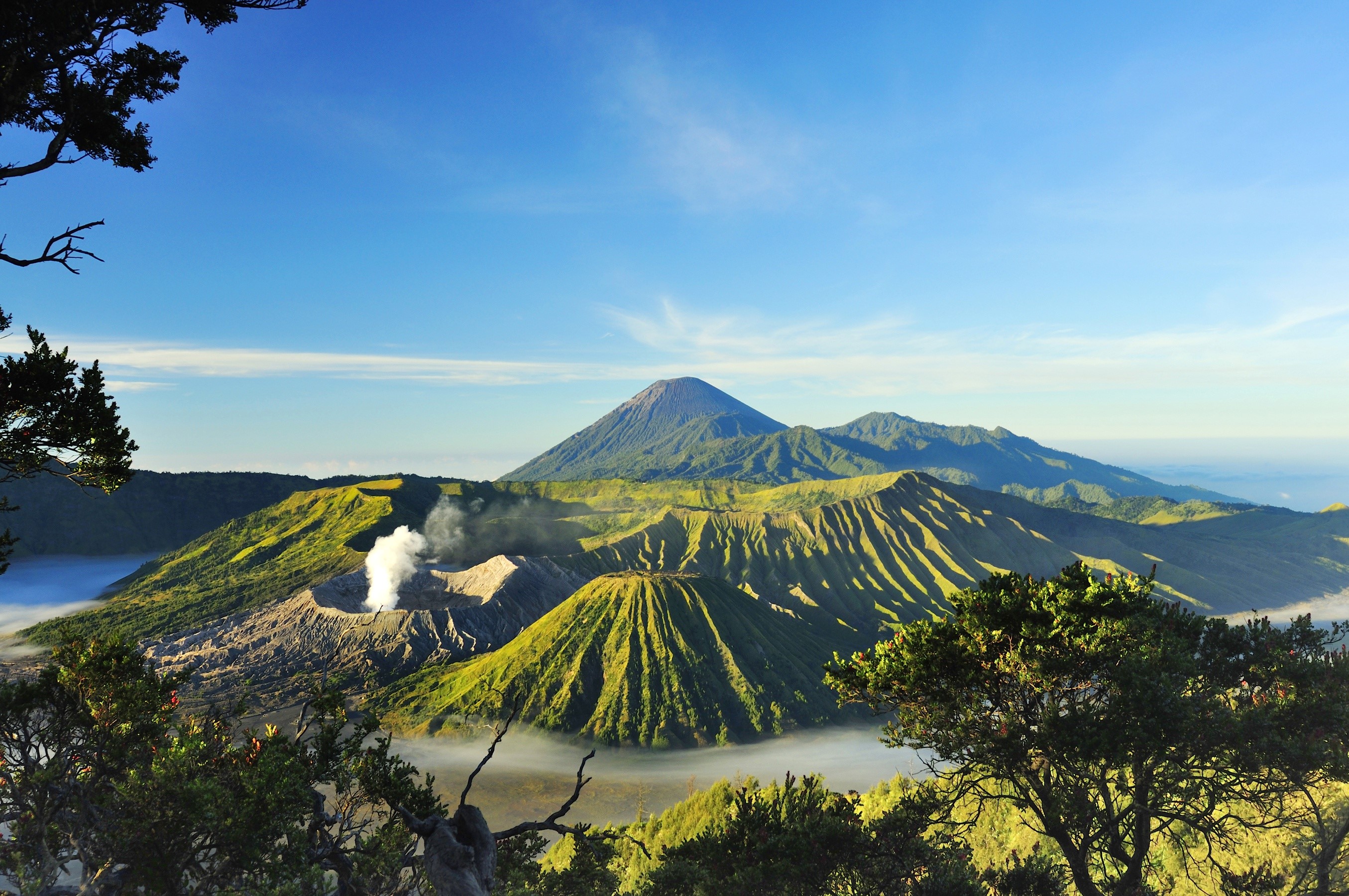 Volcanic landscape with smoking crater and mountains HD Wallpaper