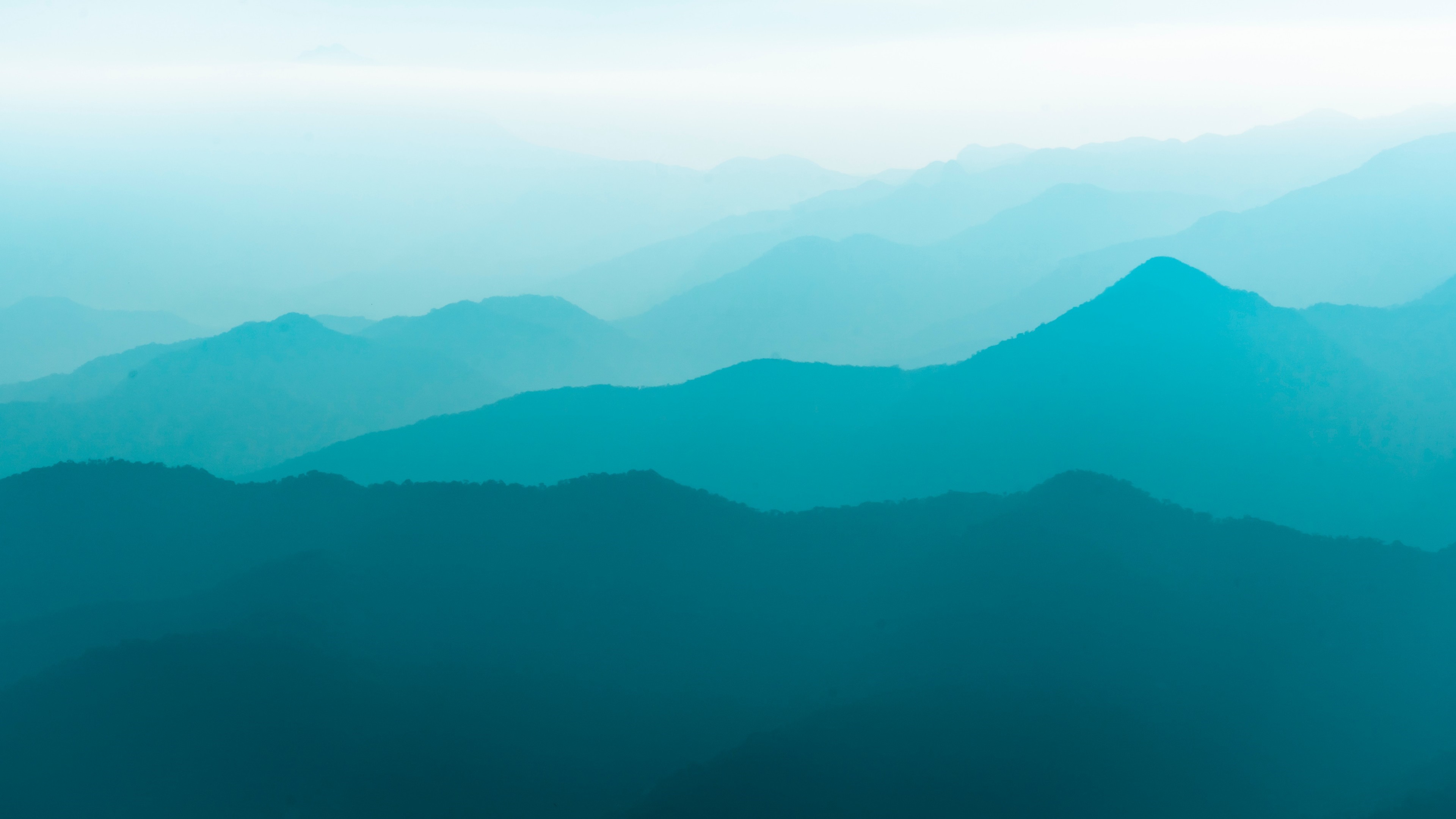 4K blue mountains landscape with cyan and turquoise hues HD Wallpaper