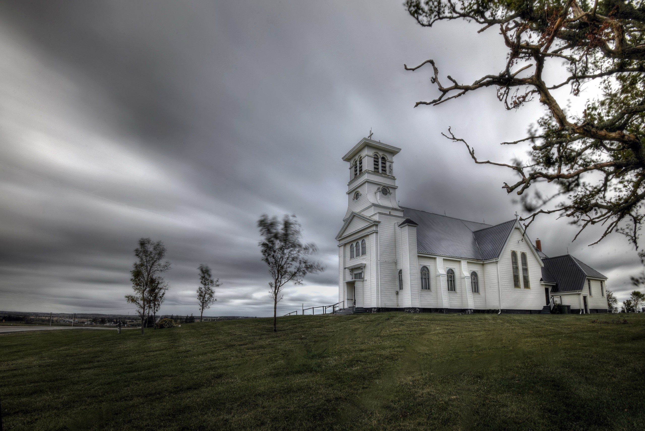 White church on a hill under an overcast sky in Prince Edward Island, Canada HD Wallpaper