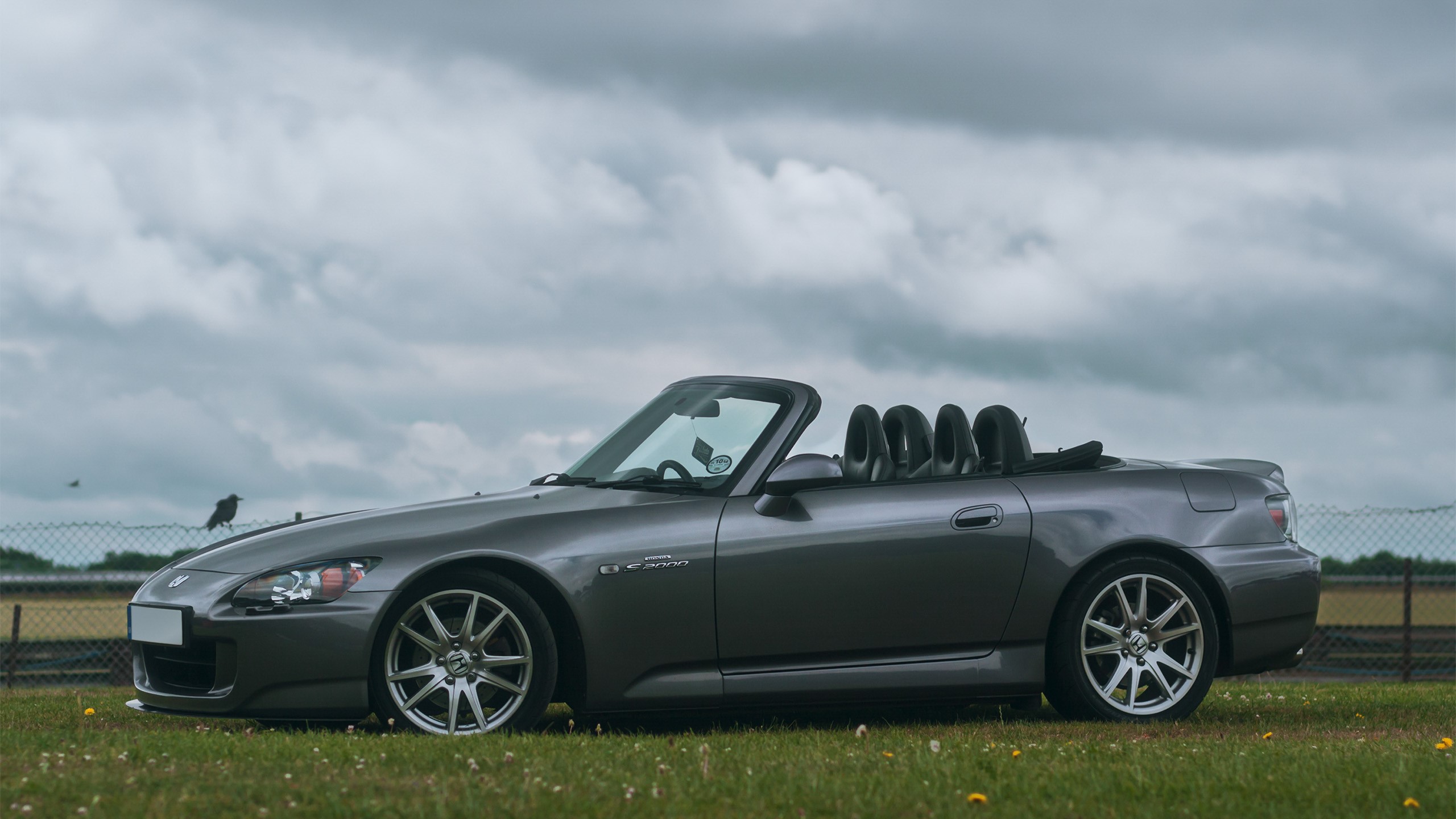 Gray Honda S2000 convertible parked on grass HD Wallpaper