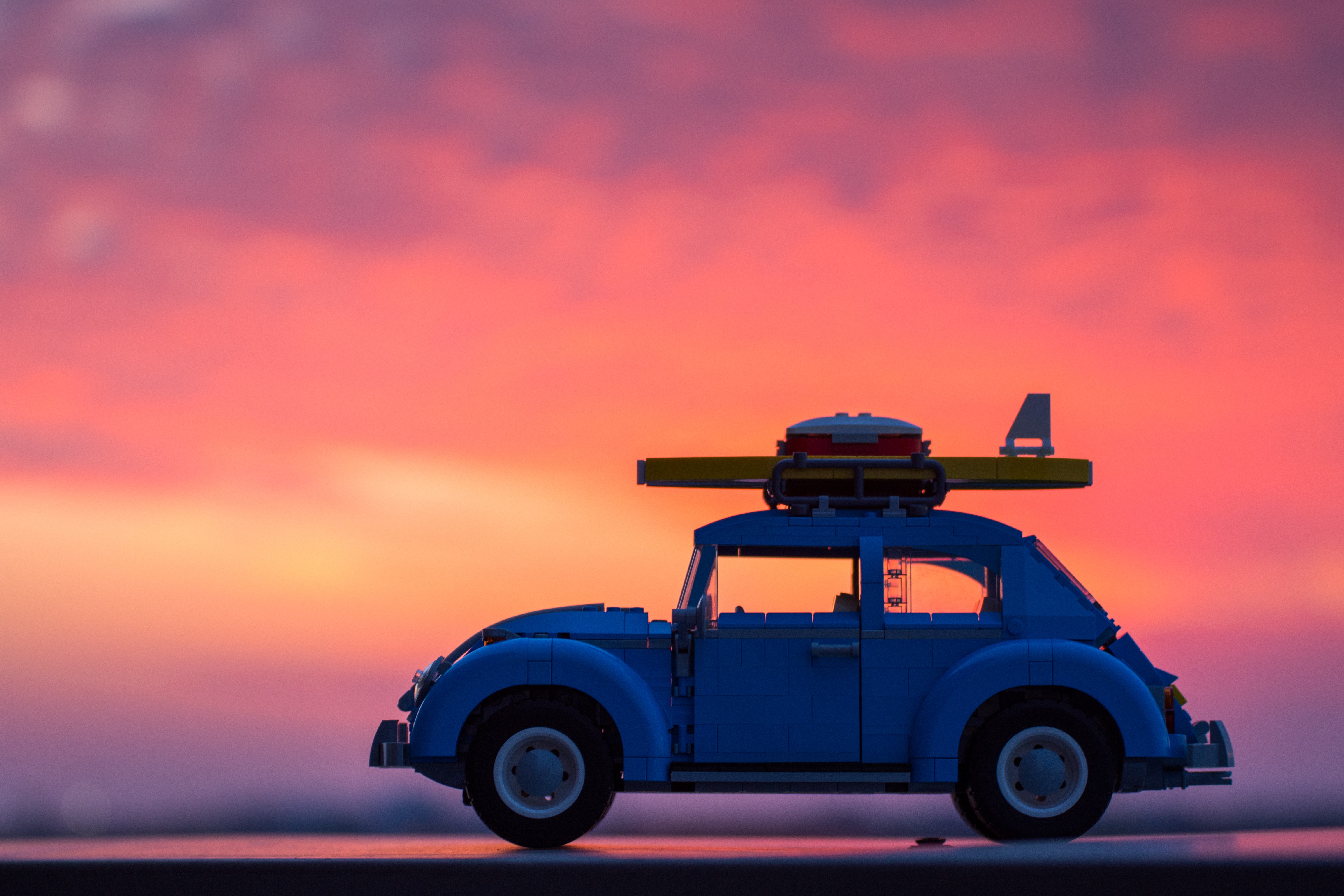 LEGO Volkswagen Beetle with surfboard at sunset HD Wallpaper