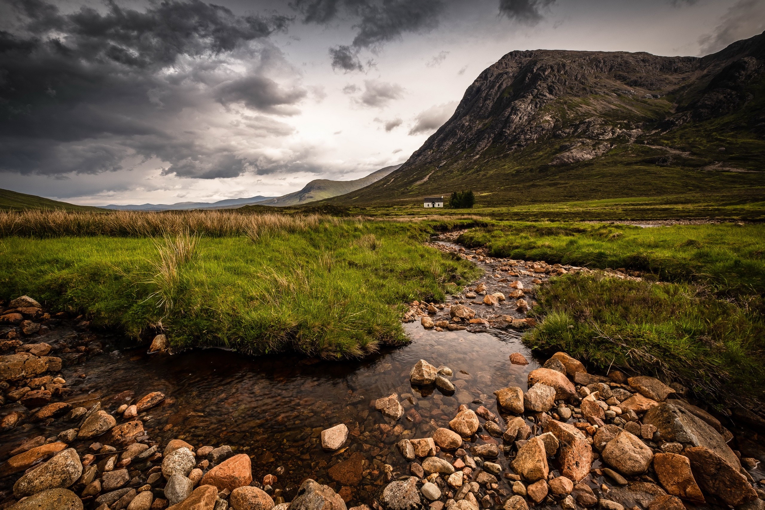 Mountain landscape with stream and house HD Wallpaper