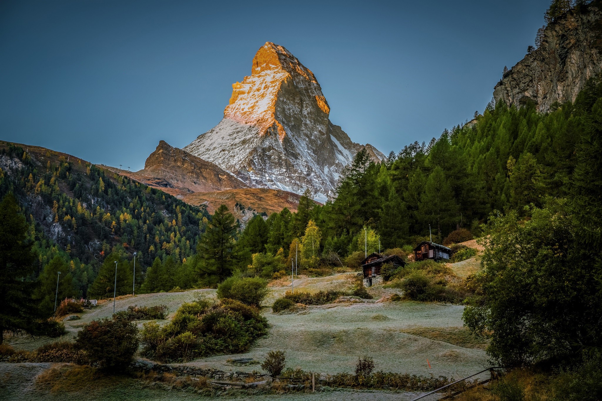 Matterhorn mountain landscape with chalets and forest HD Wallpaper