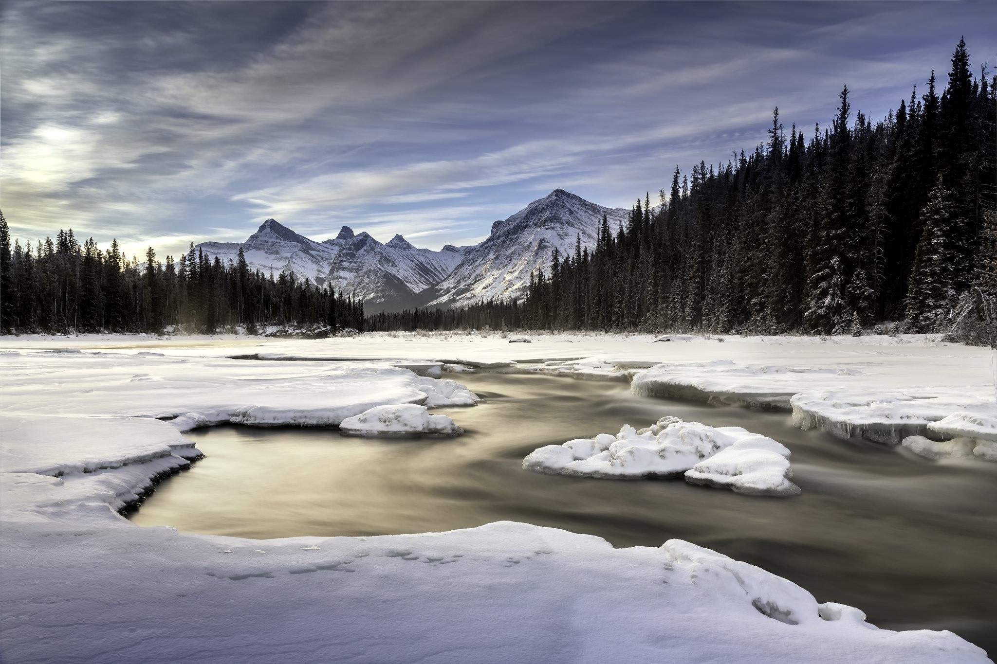 Winter landscape with mountains, forest, and river in Canada HD Wallpaper