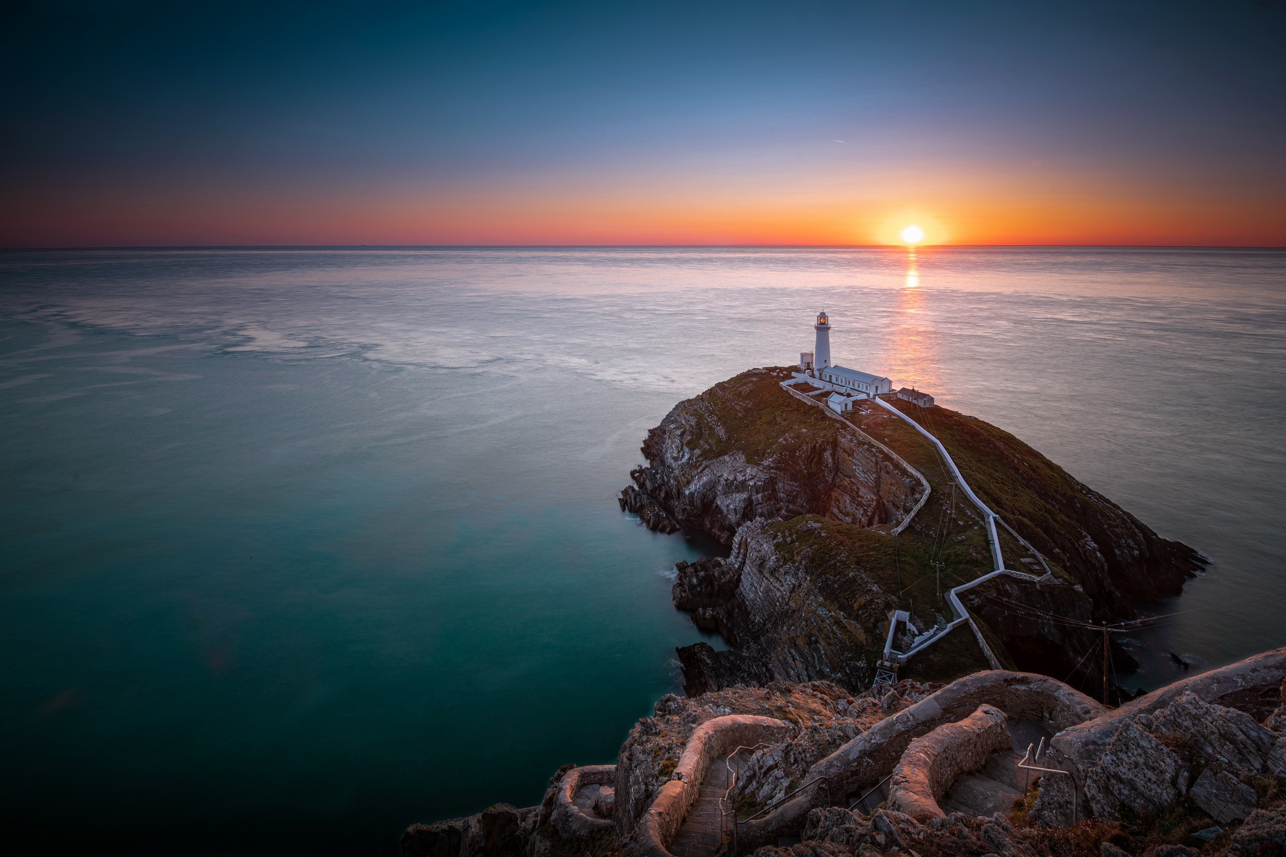 South Stack Lighthouse at sunset, Wales HD Wallpaper