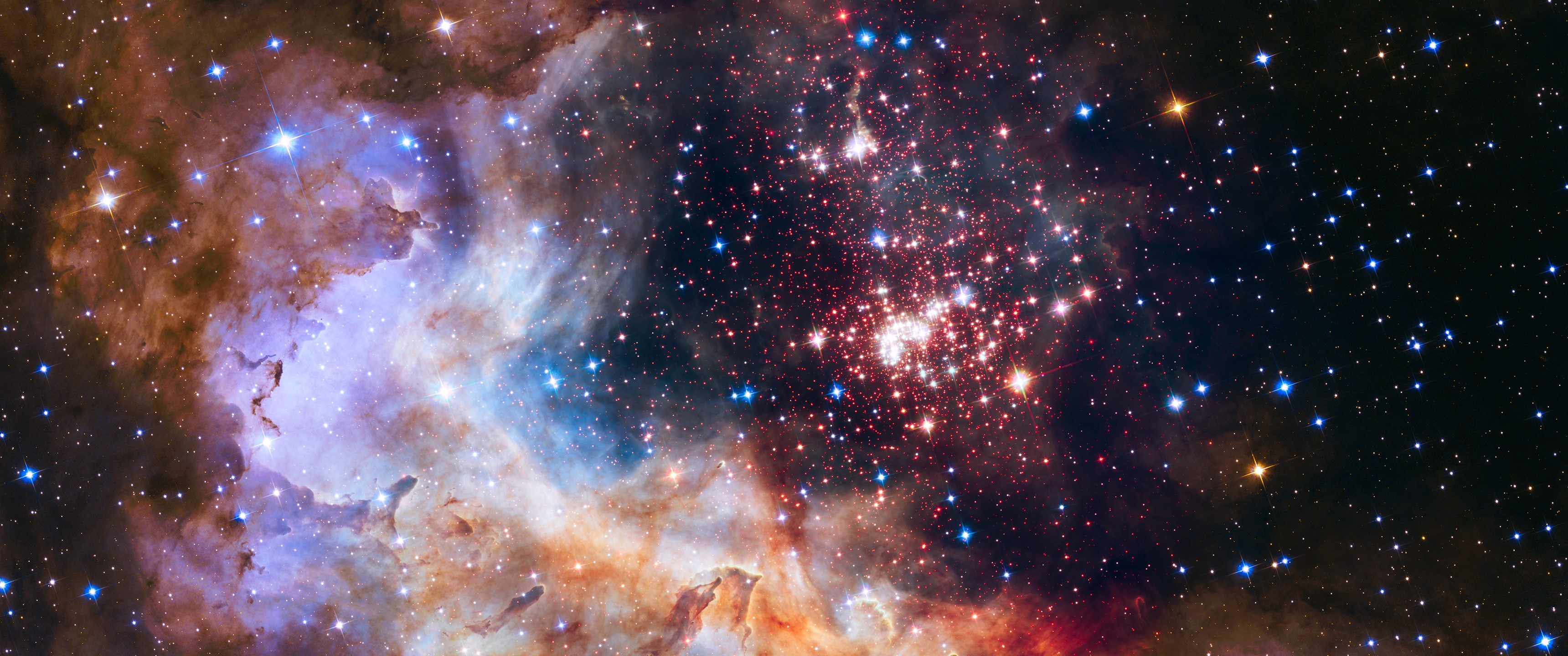 Star cluster within a colorful nebula HD Wallpaper