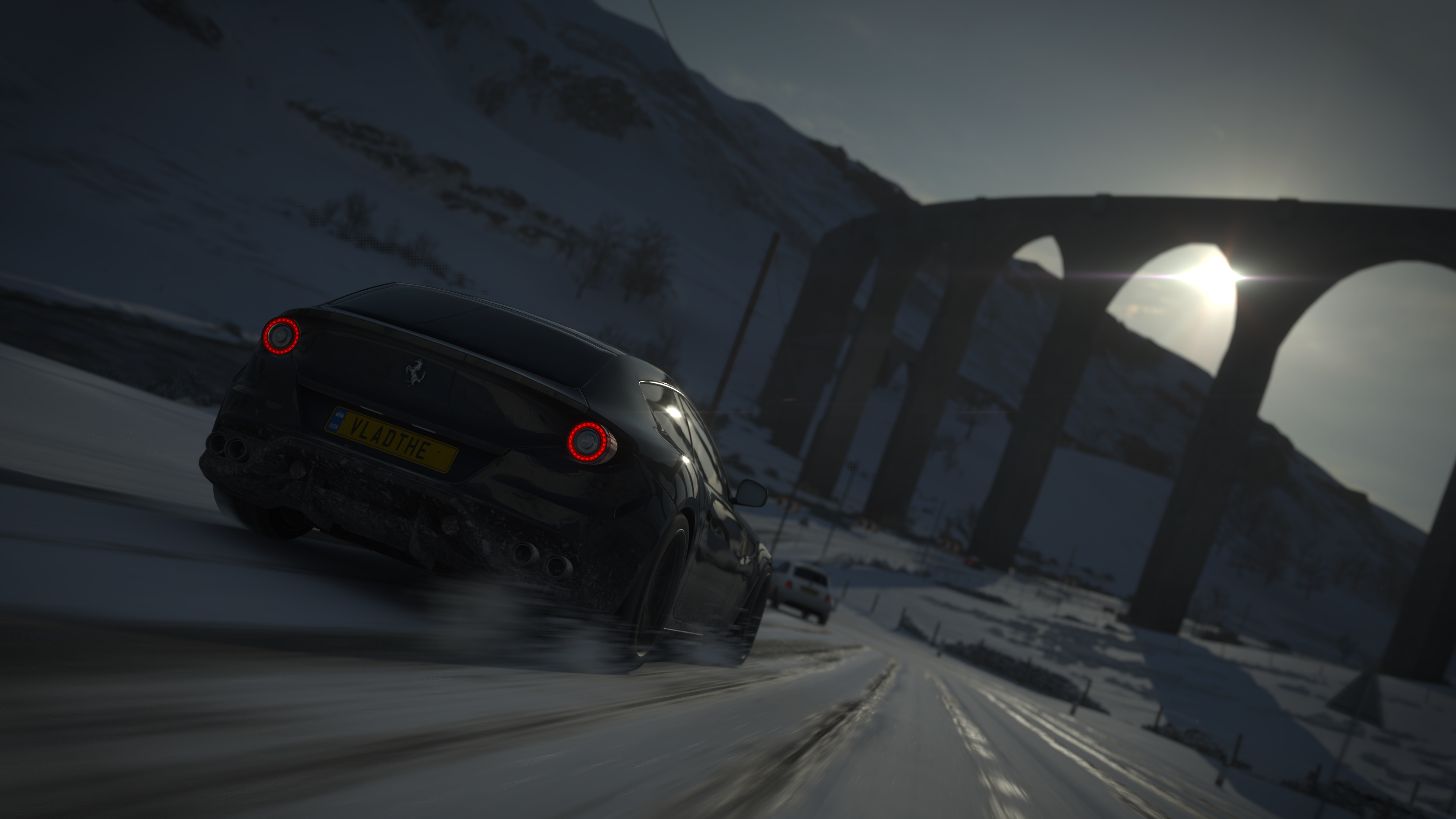 Ferrari driving on a snowy road in Forza Horizon 4 HD Wallpaper