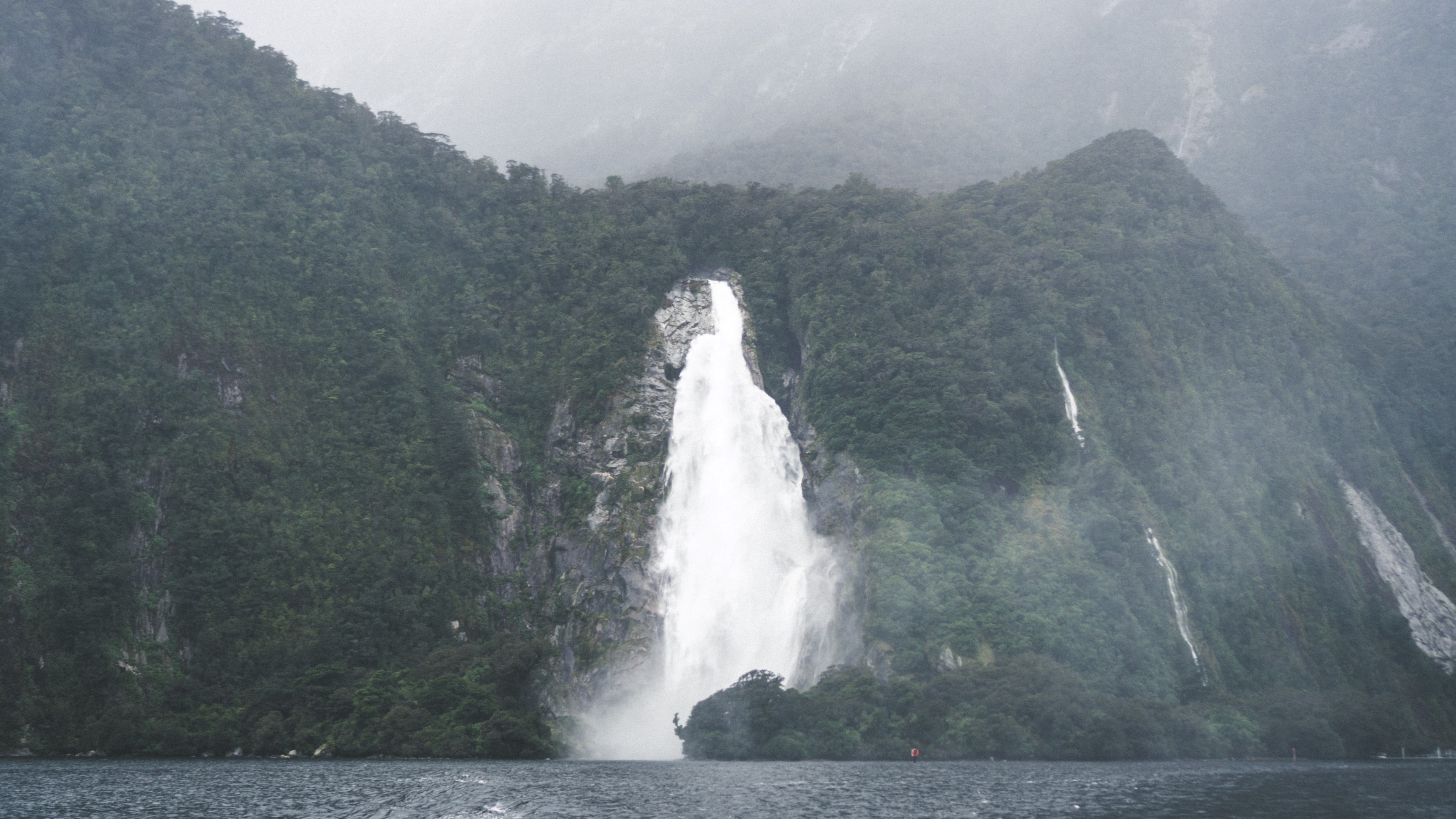 Waterfall in Milford Sound, New Zealand HD Wallpaper