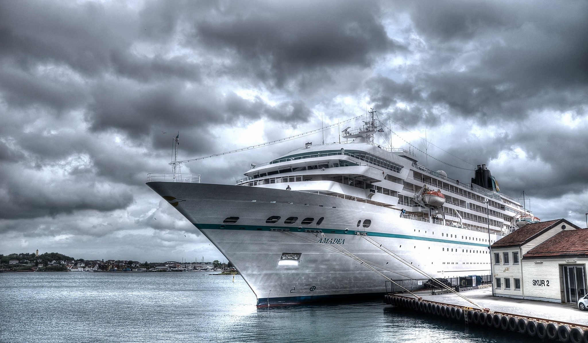 Amadea cruise ship docked under cloudy sky HD Wallpaper