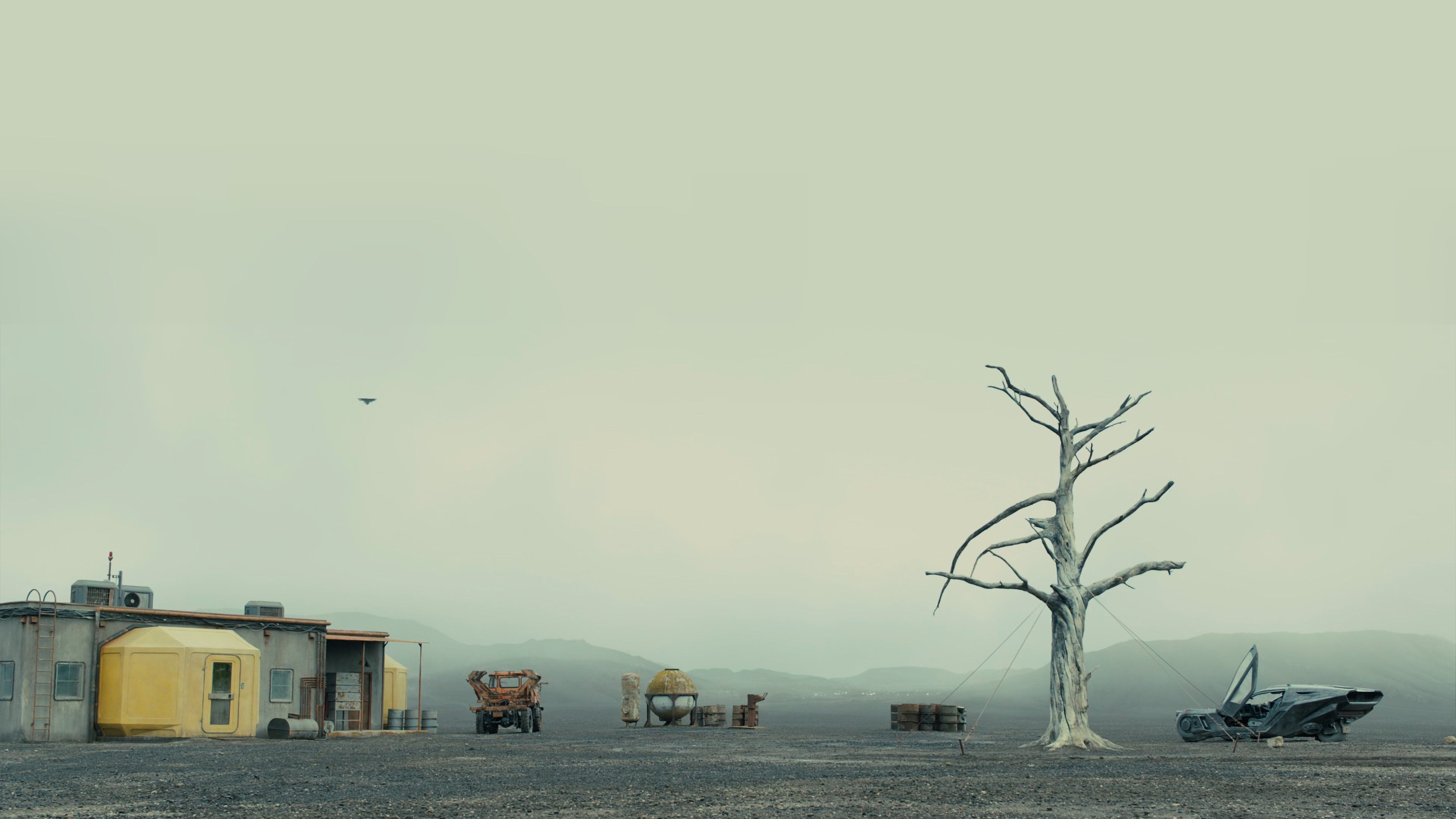 Blade Runner 2049 dystopian landscape with vehicle and tree HD Wallpaper