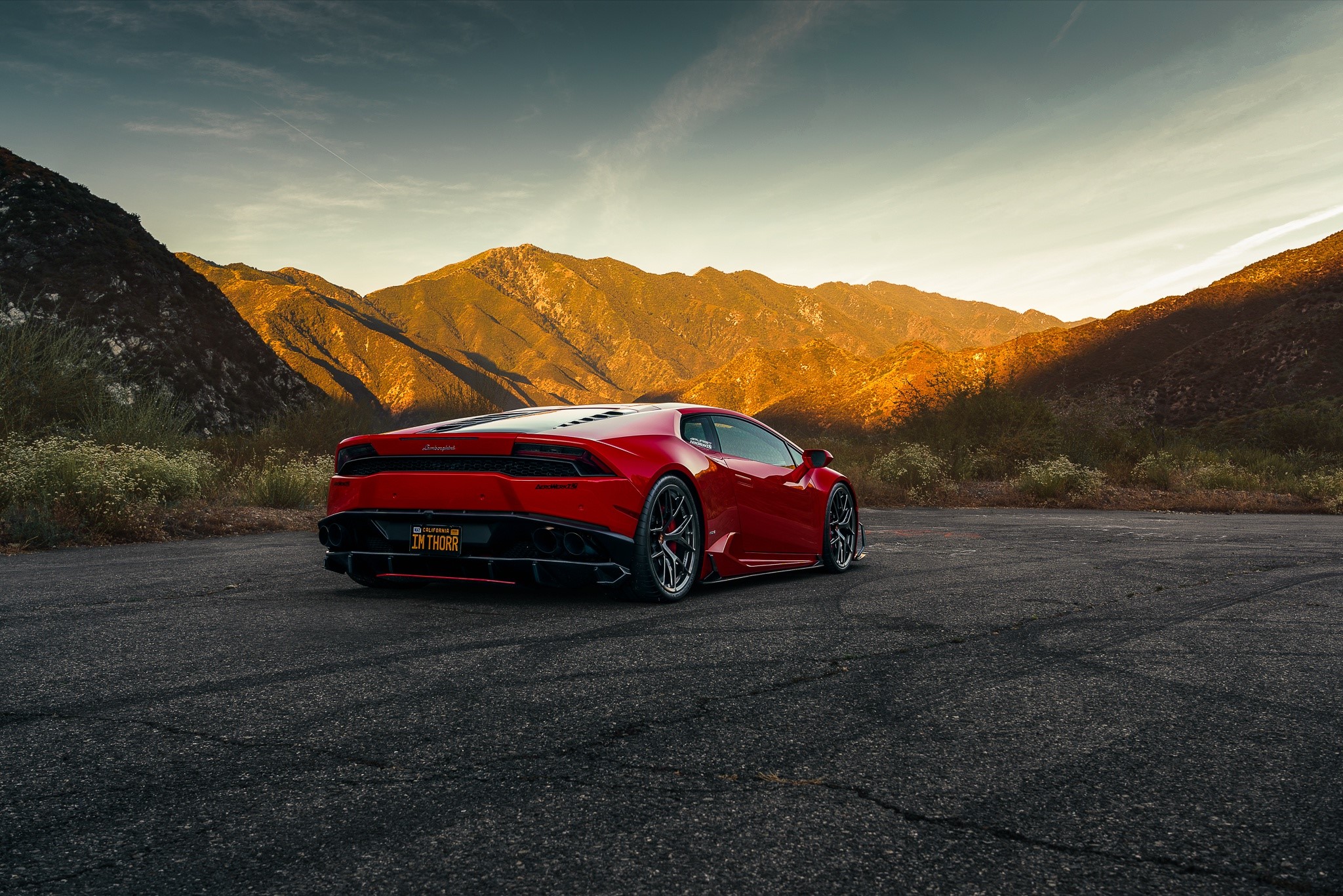 Red Lamborghini Huracan on a mountain road HD Wallpaper