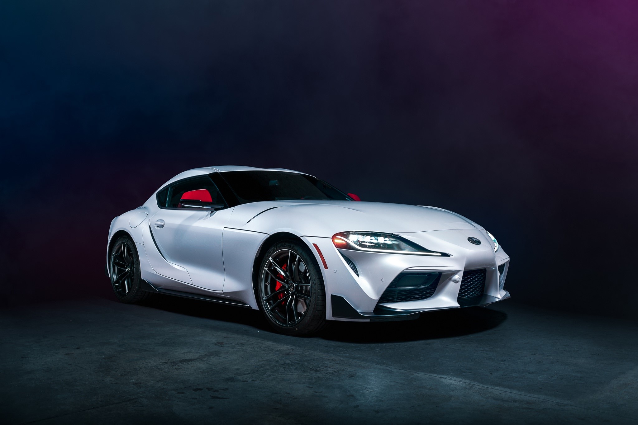 White Toyota Supra sports car with red accents HD Wallpaper