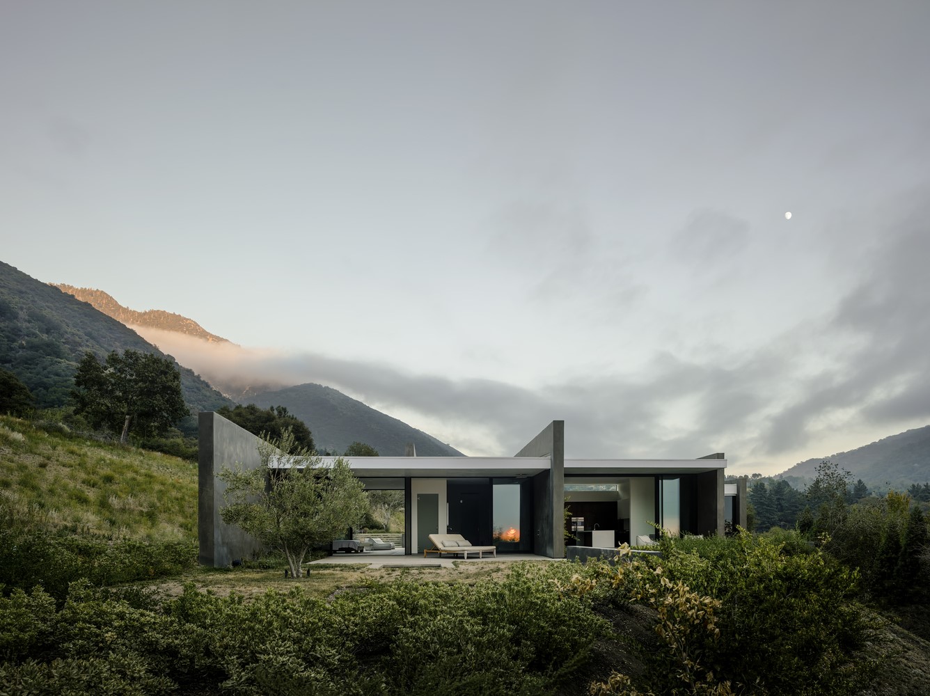 Modern house in mountains with clouds HD Wallpaper
