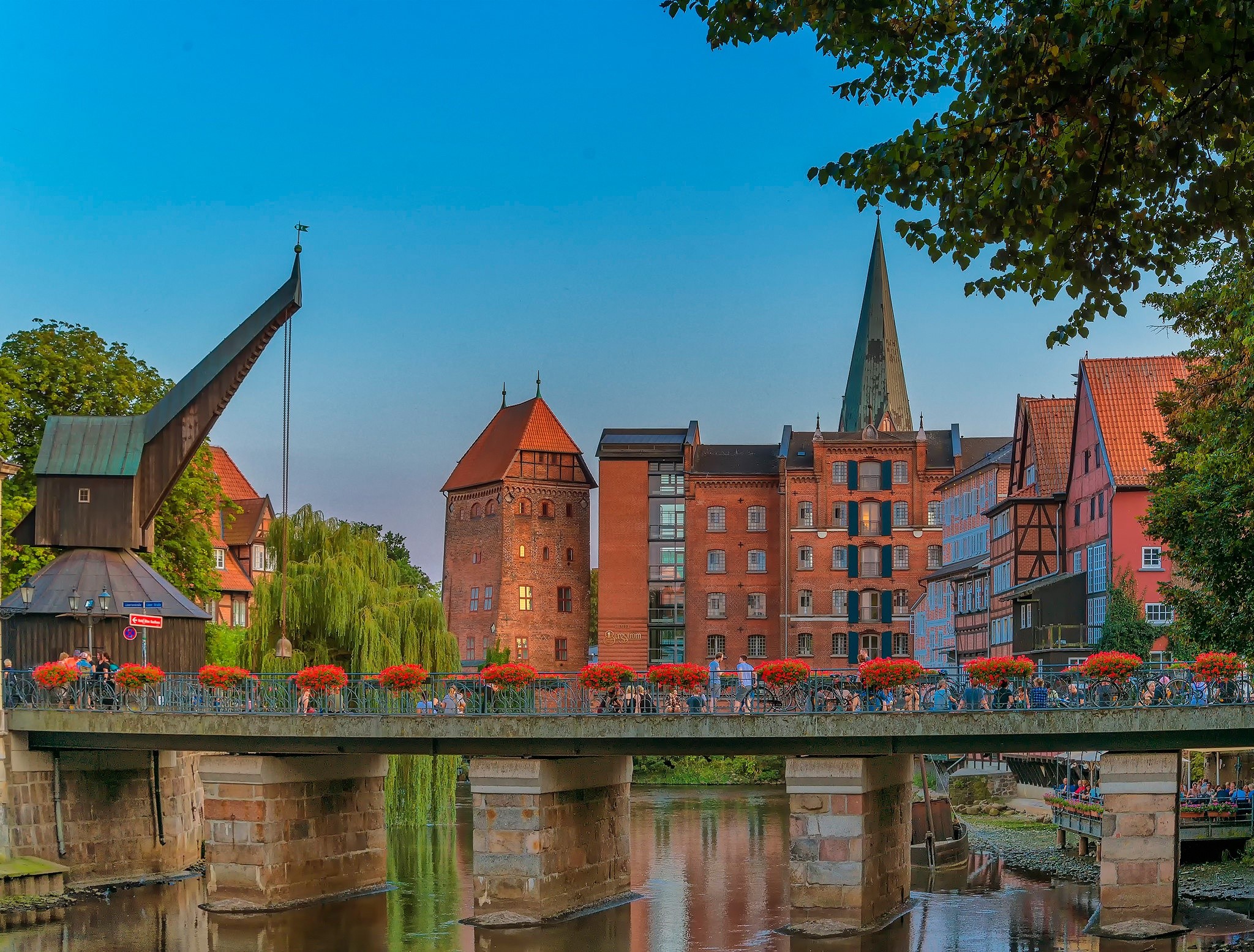 Bridge over river in German city with historic buildings HD Wallpaper