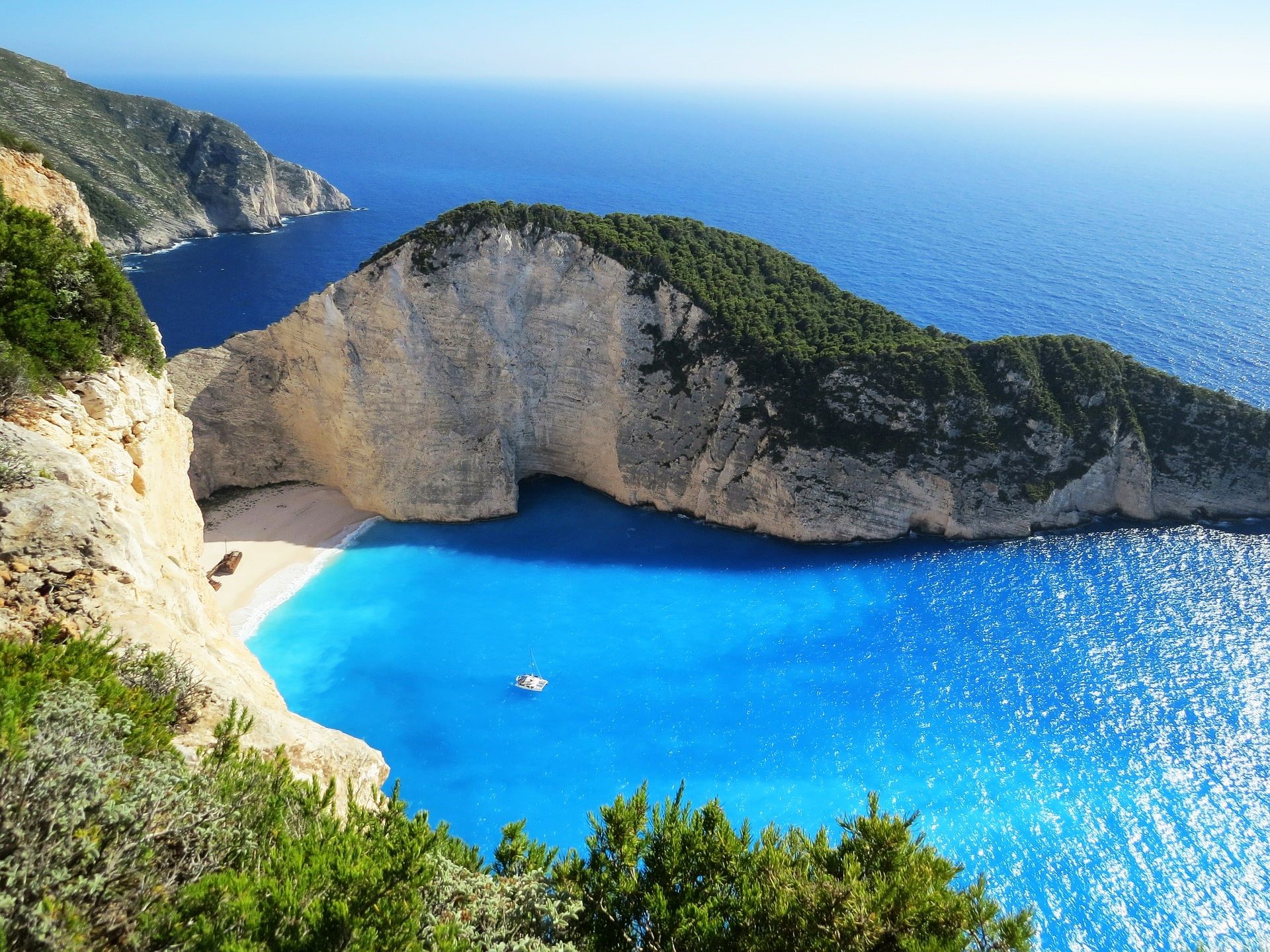 Navagio Beach, Greece with cliffs and blue sea HD Wallpaper