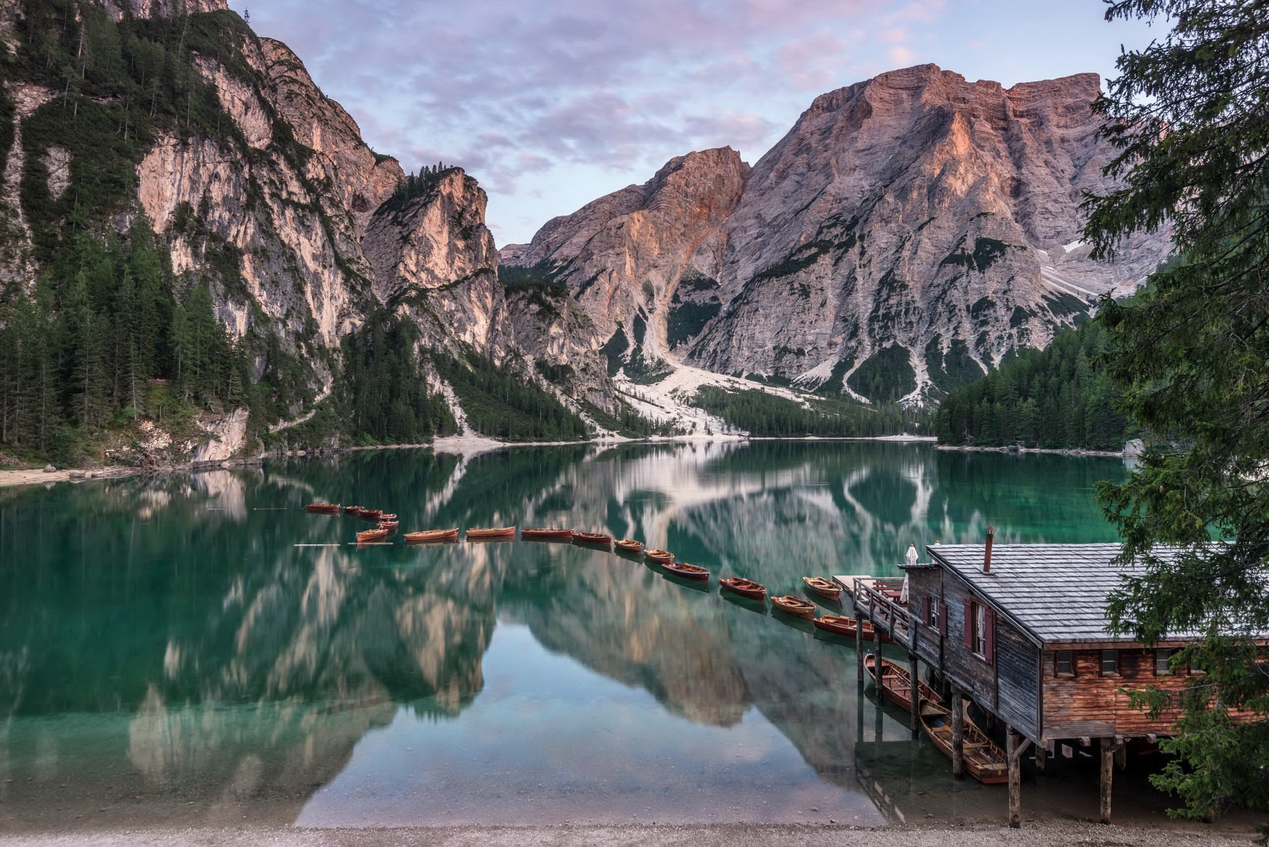 Braies Lake with boats and mountains in South Tyrol HD Wallpaper