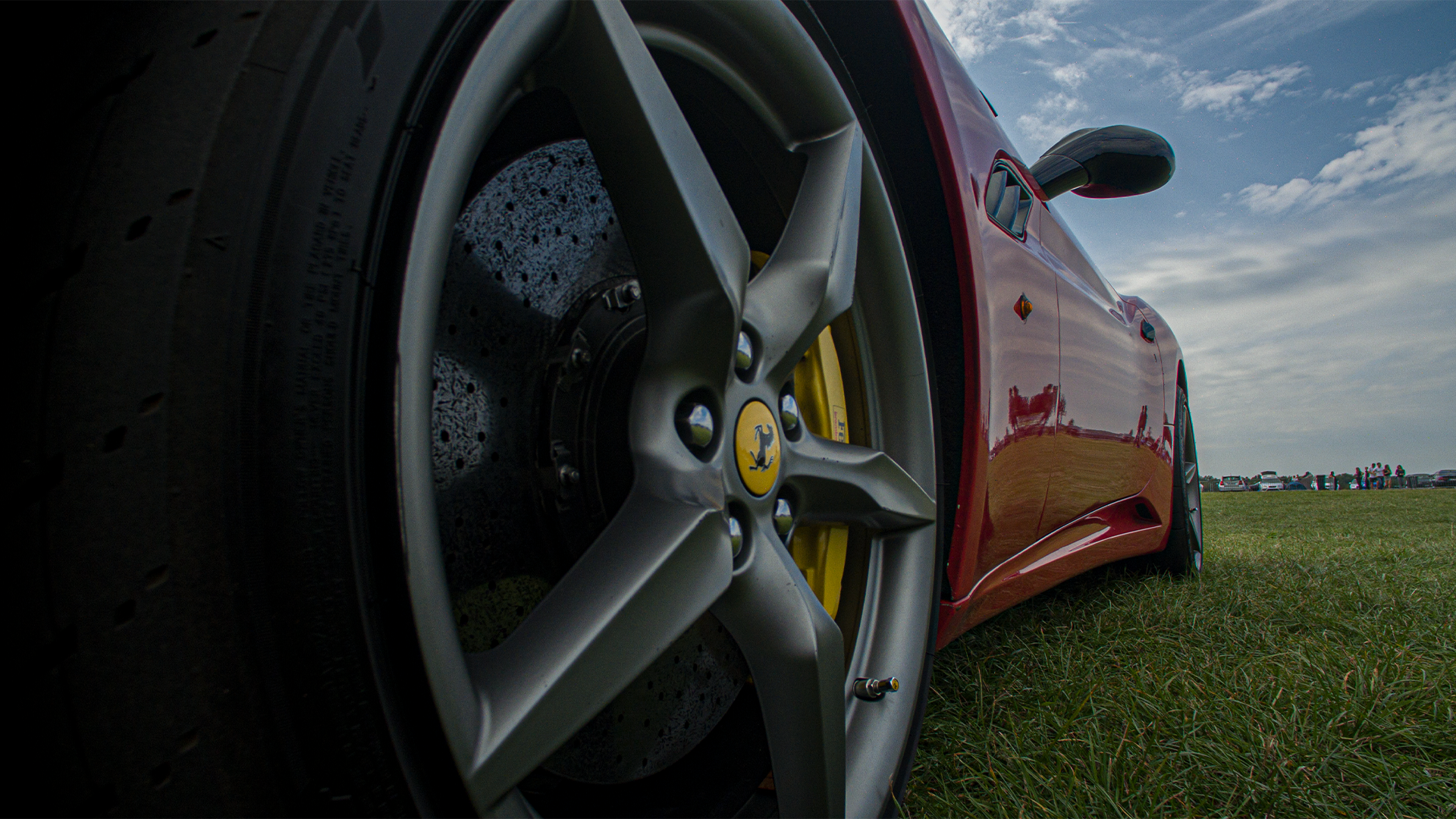 Ferrari sports car wheel and tire close-up HD Wallpaper