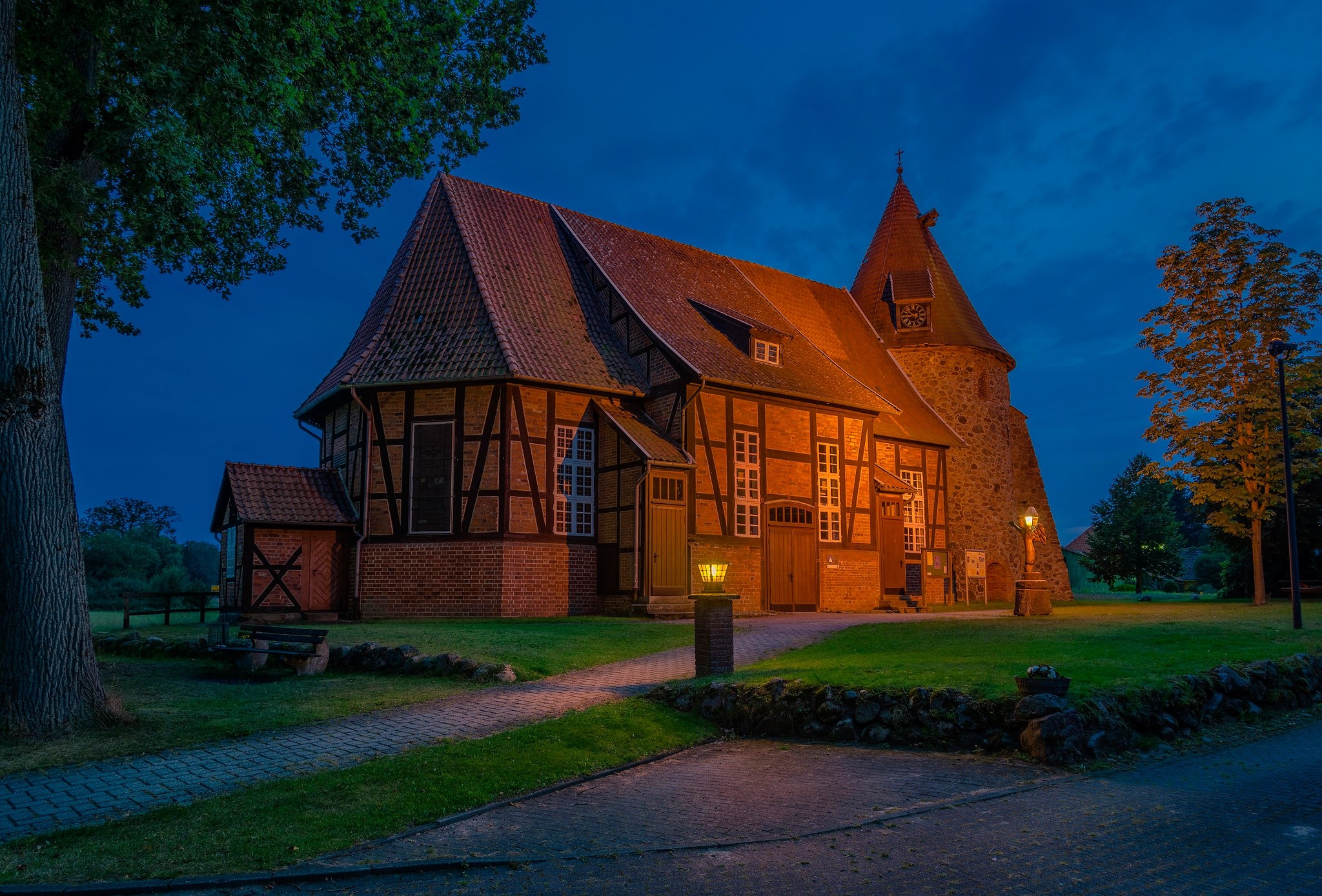 Timber-framed church at night in Germany HD Wallpaper