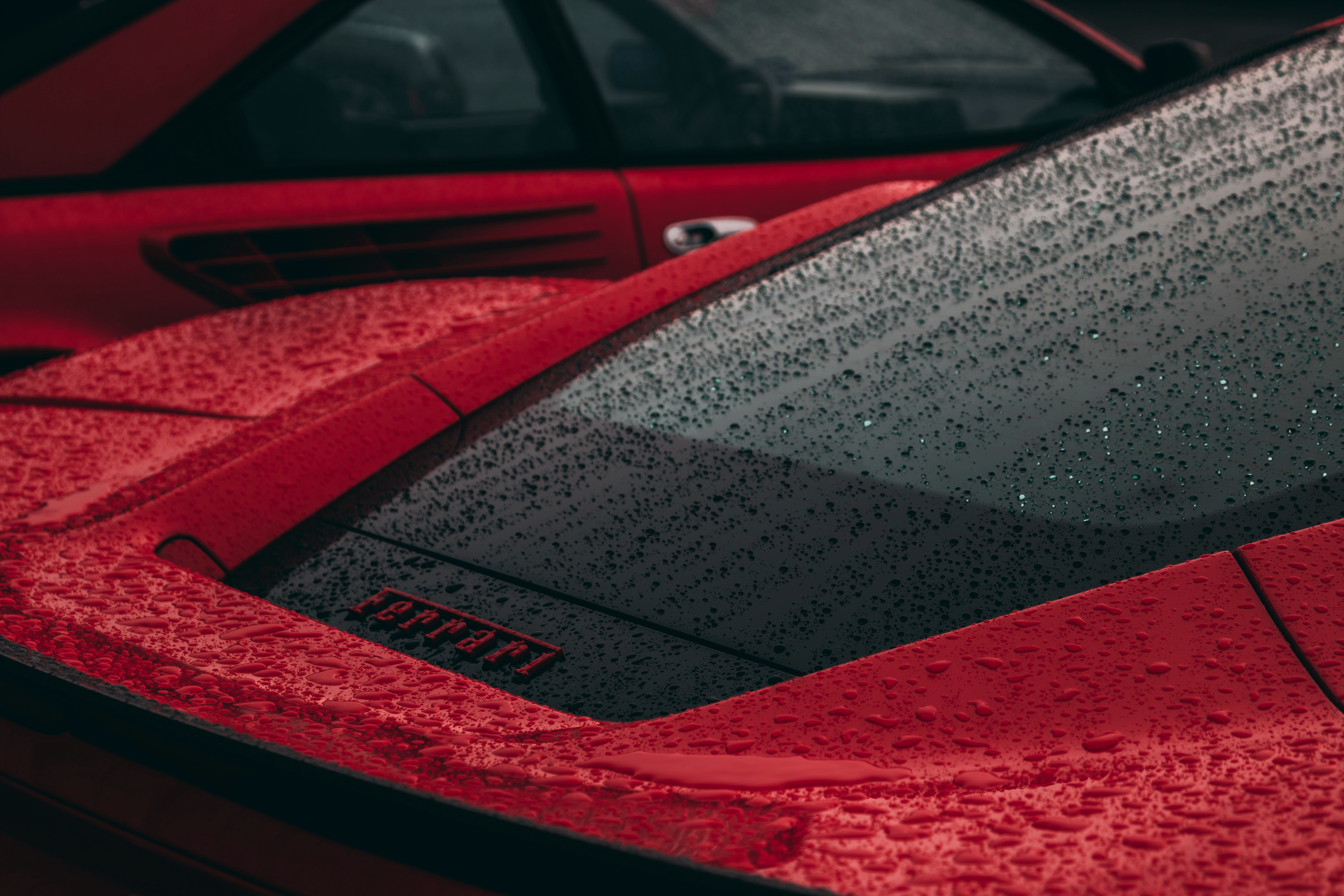 Red Ferrari with rain drops HD Wallpaper
