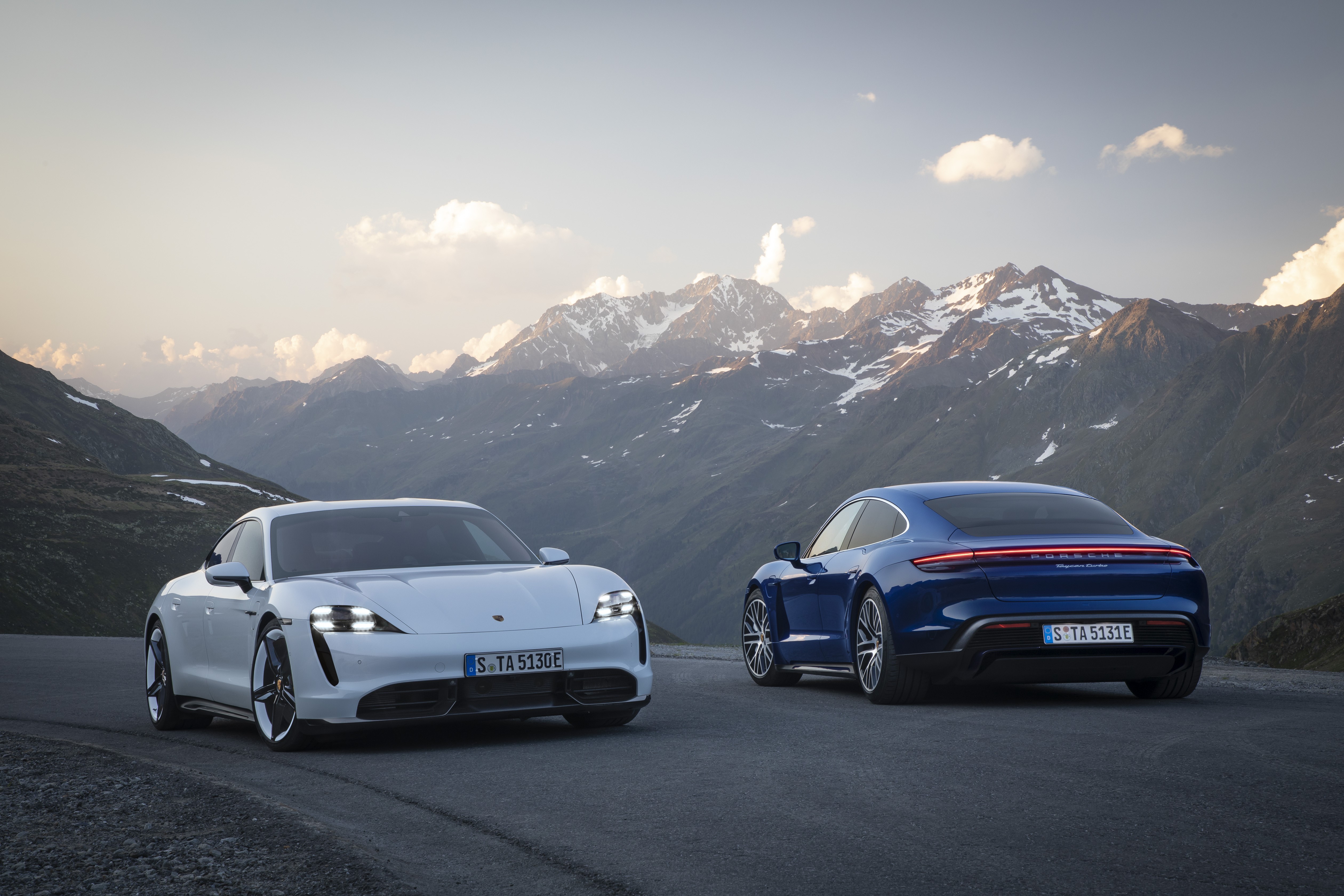 4K Porsche Taycan electric cars in mountains HD Wallpaper