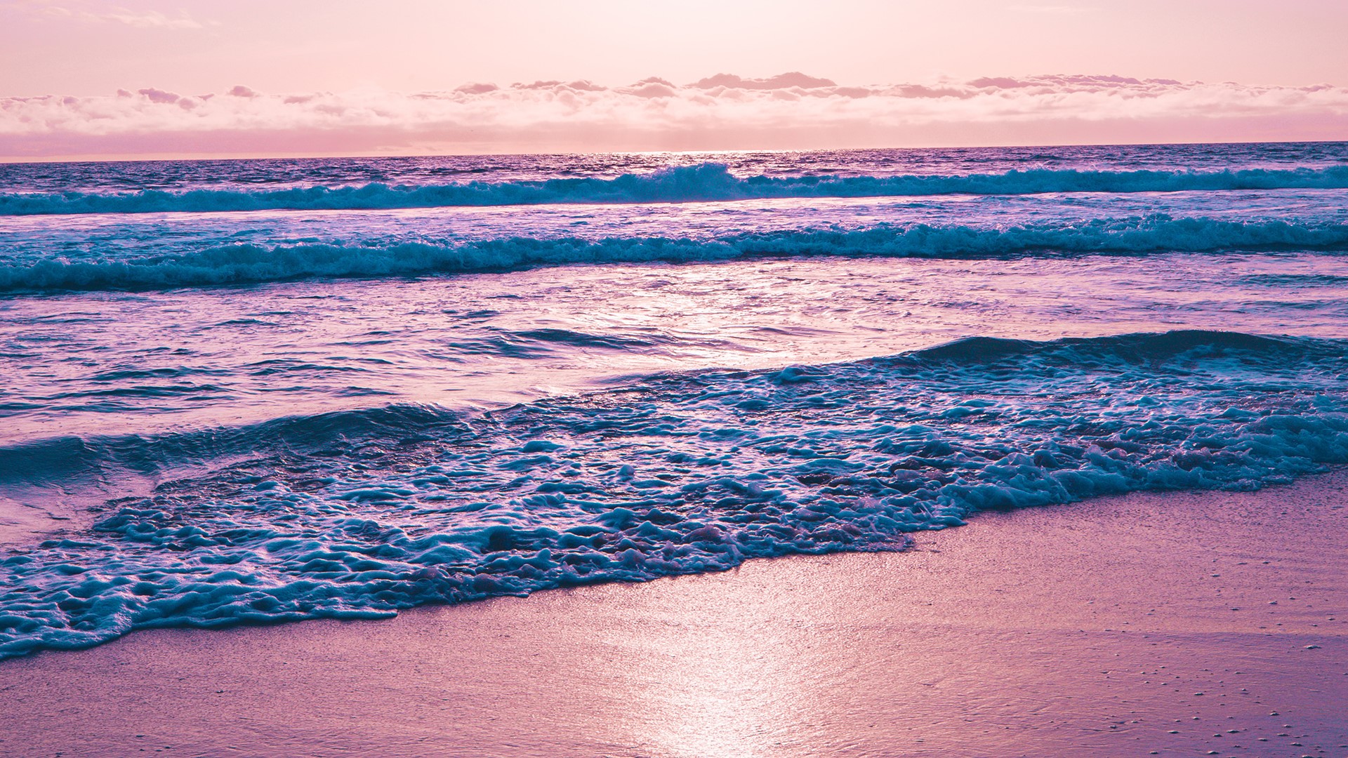 Waves crashing on a beach at sunset HD Wallpaper