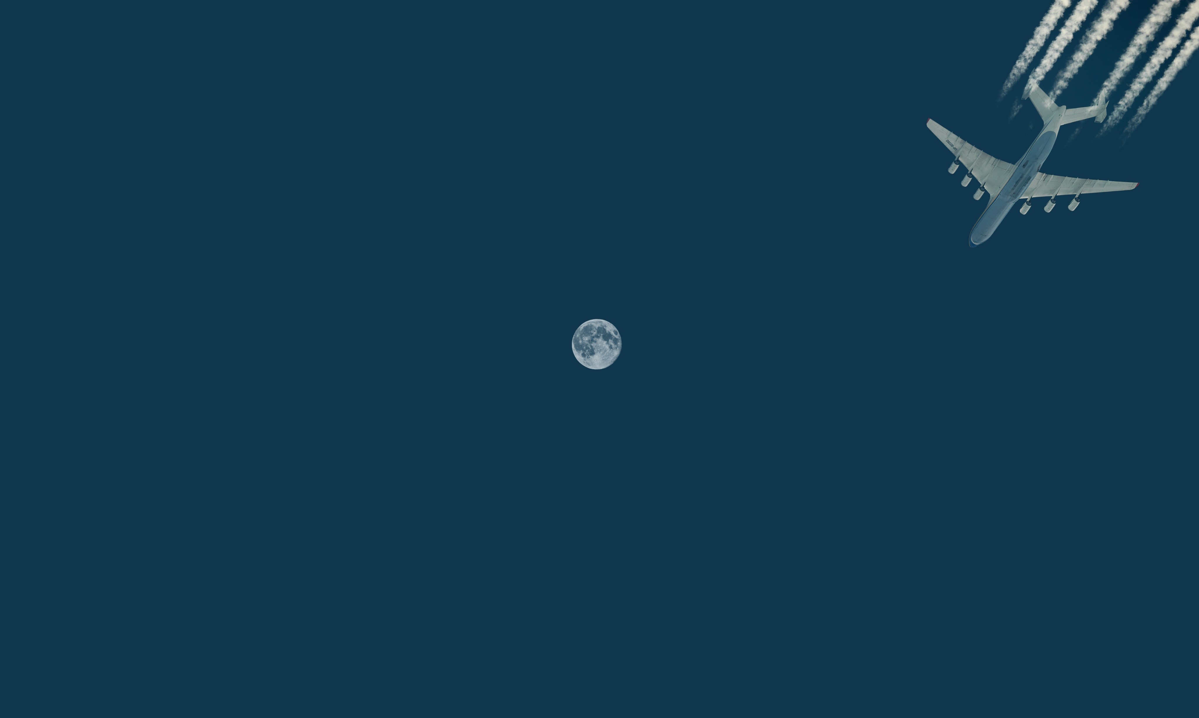 Airplane flying near the Moon HD Wallpaper