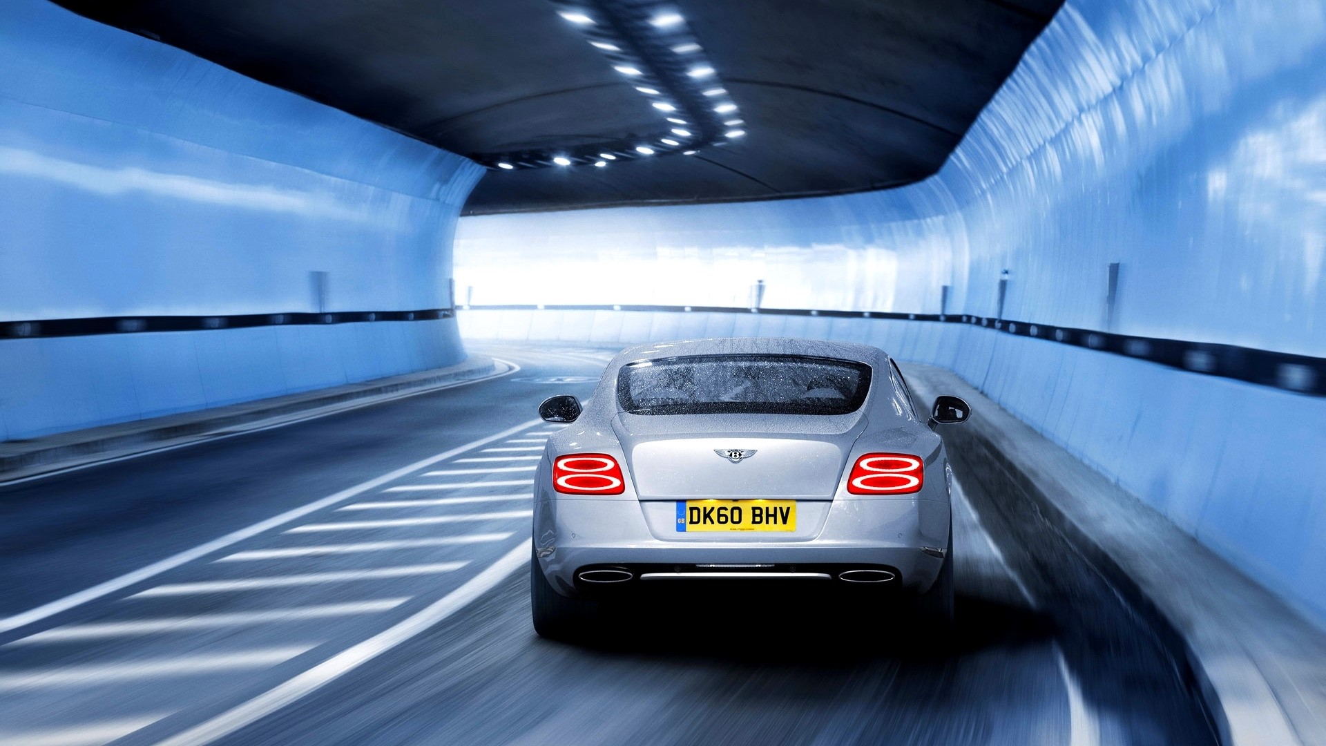 Bentley Continental GT driving through a blue tunnel HD Wallpaper