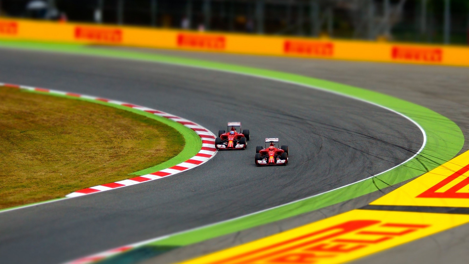Two Ferrari F1 race cars on a track HD Wallpaper