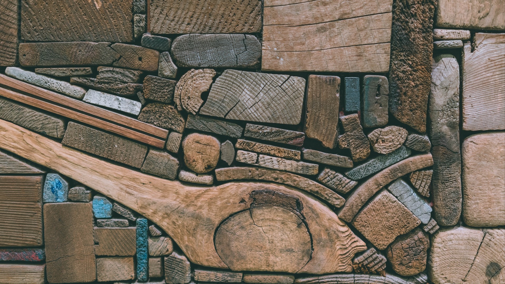 Abstract mosaic of various wood pieces and some blue accents HD Wallpaper