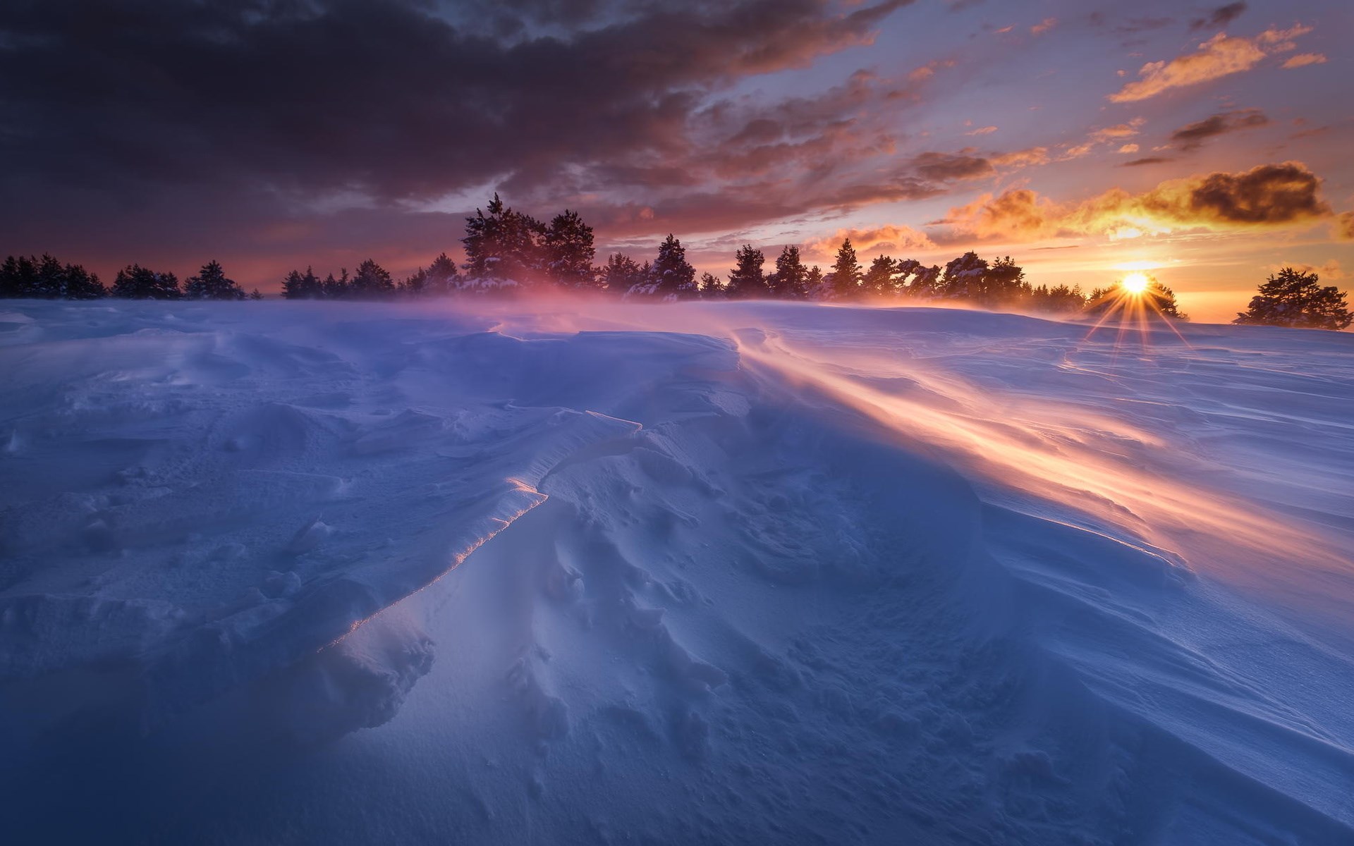 Snowy landscape at sunset with wind-blown snow HD Wallpaper