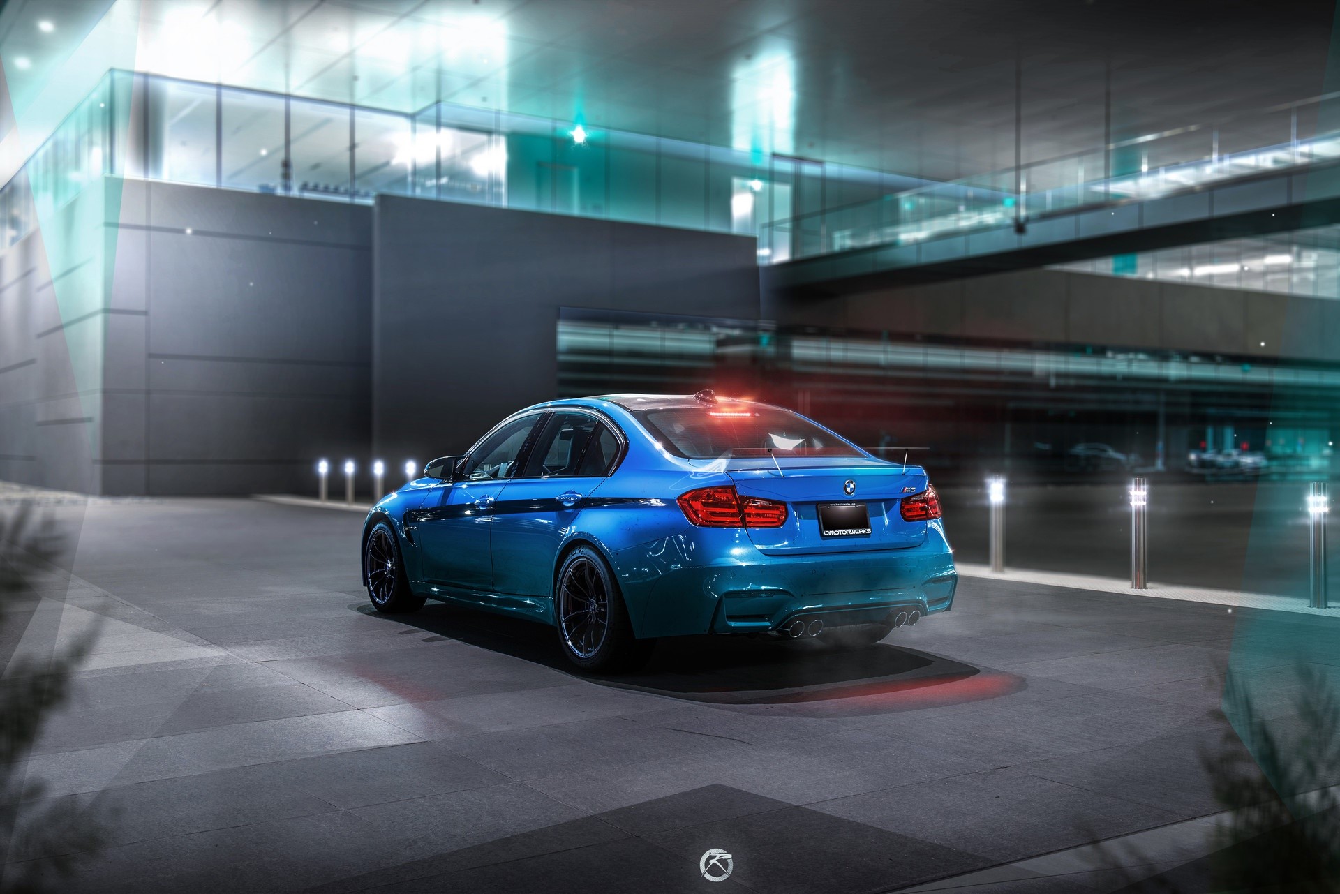 Blue BMW M3 Sedan parked outside modern building HD Wallpaper