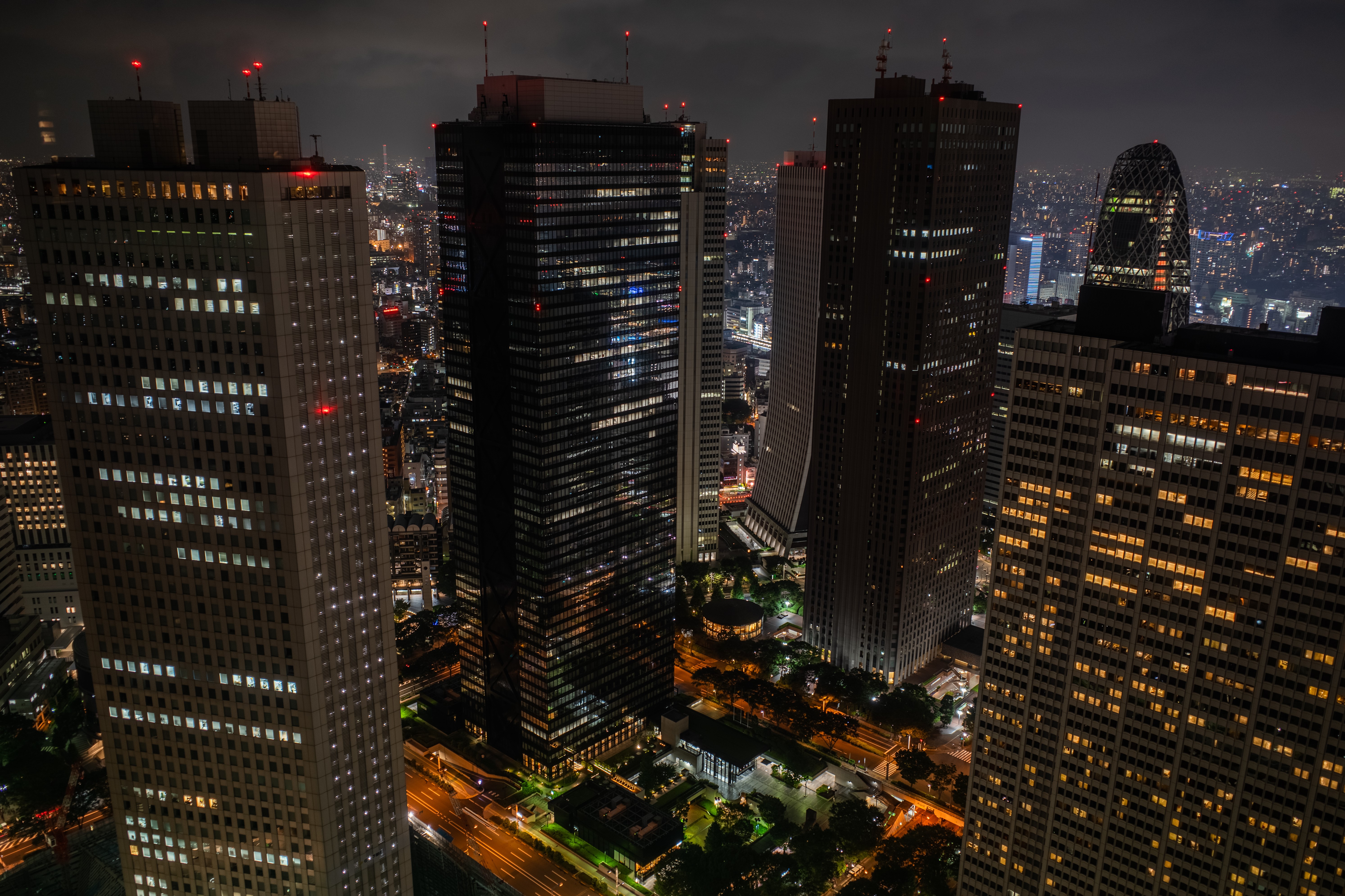Tokyo cityscape at night with illuminated skyscrapers HD Wallpaper