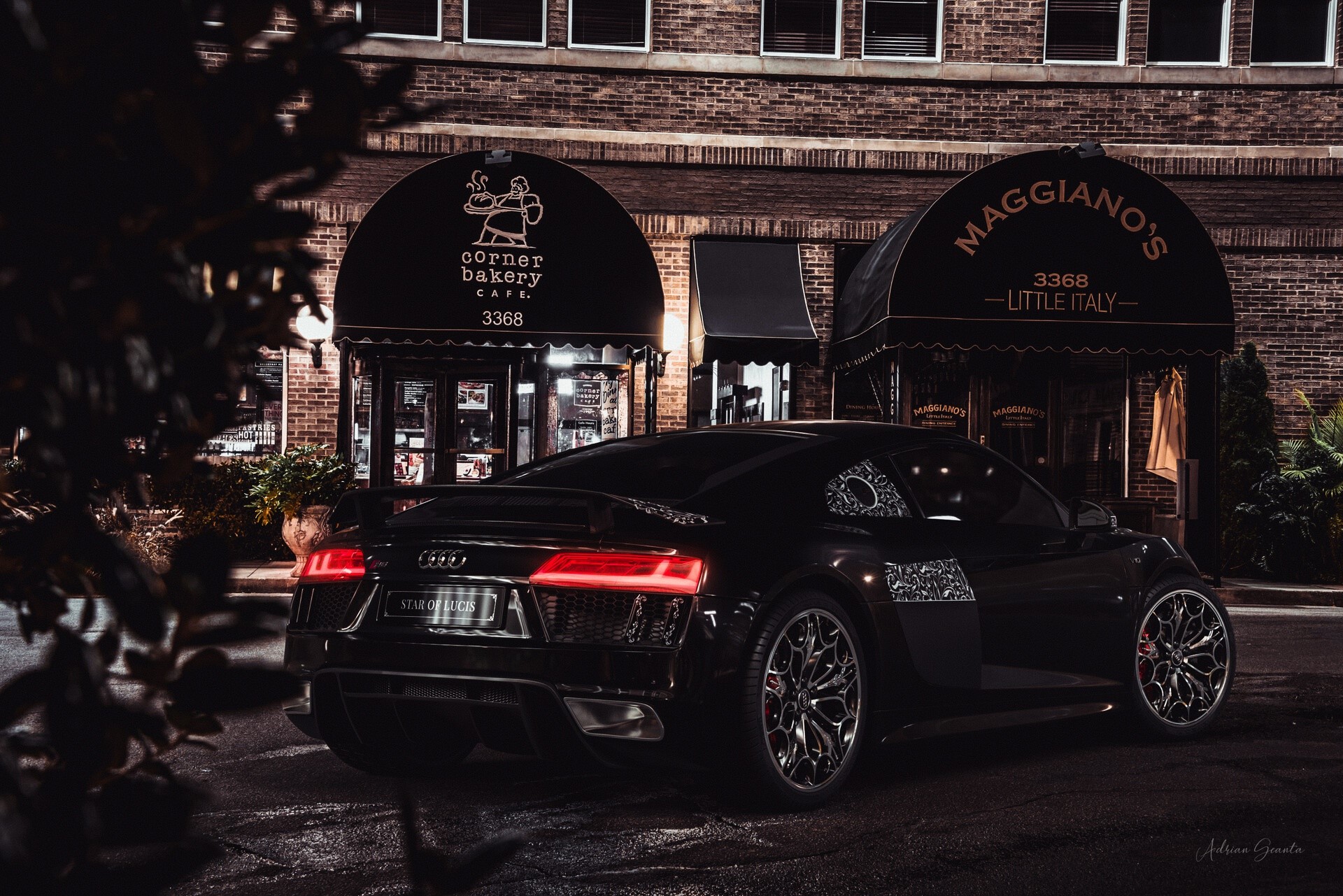 Black Audi R8 parked in front of Maggiano's Little Italy and Corner Bakery Cafe at night HD Wallpaper