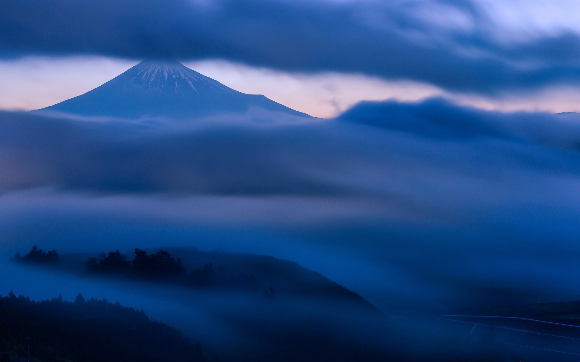 Mount Fuji shrouded in mist at dawn HD Wallpaper