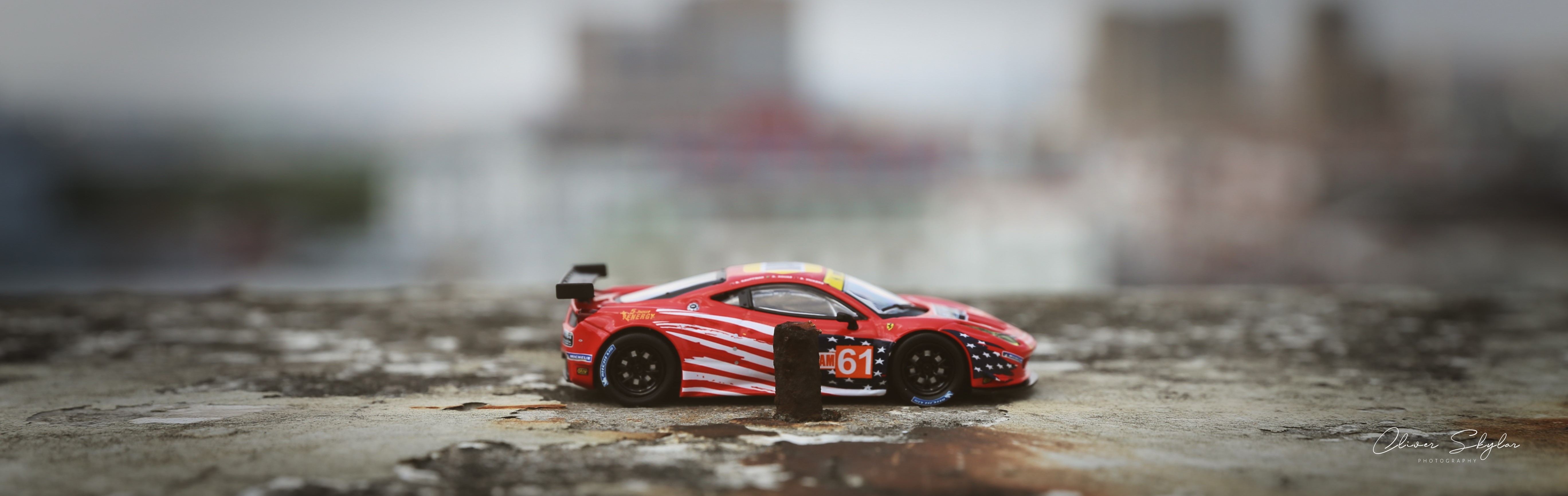 Red Ferrari 458 race car on textured surface HD Wallpaper
