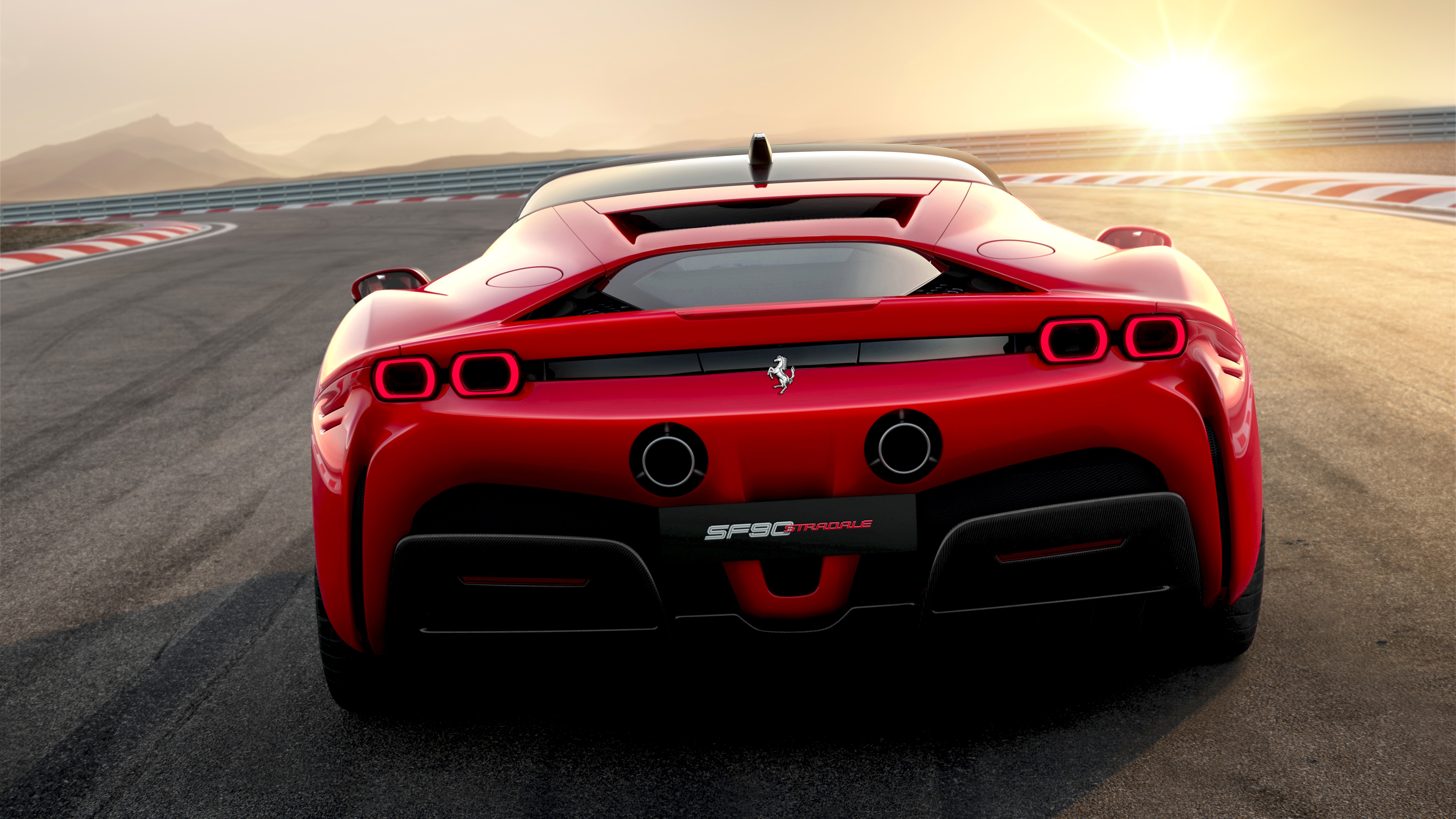 Ferrari SF90 Stradale on a race track at sunset HD Wallpaper