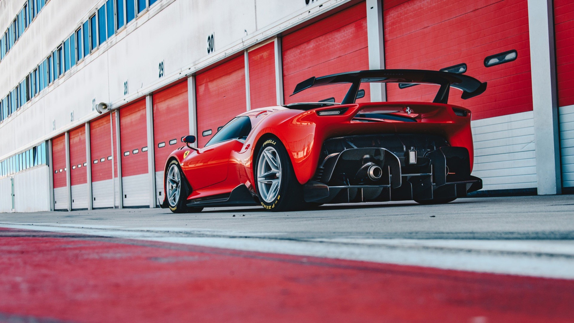 Red Ferrari P80/C on a Race Track HD Wallpaper