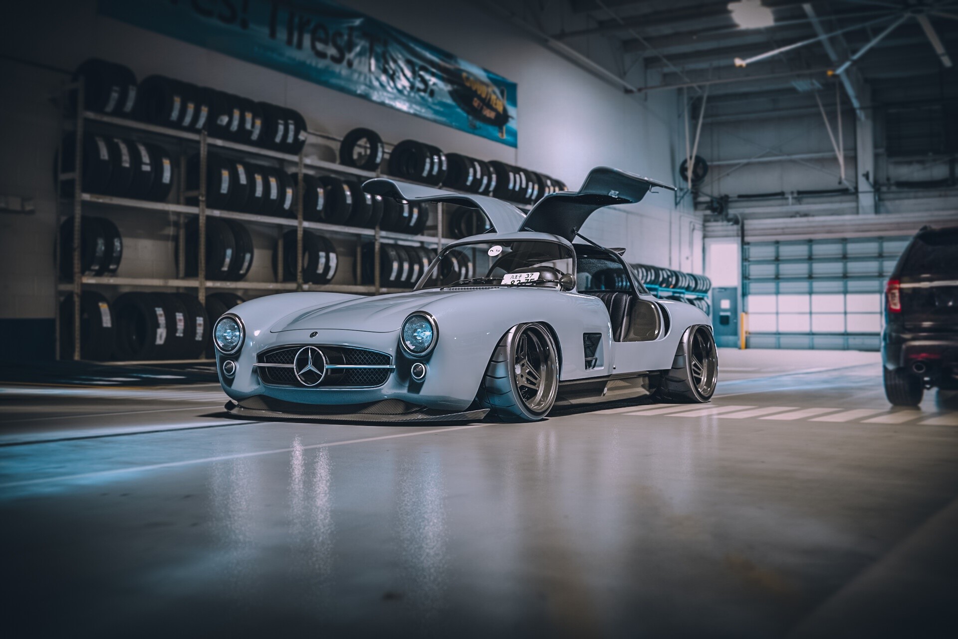 Modified Mercedes-Benz 300 SL Gullwing in a garage HD Wallpaper