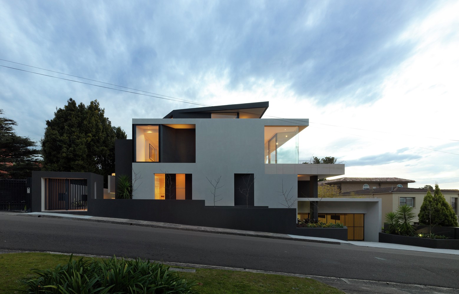Modern house with geometric design and large windows HD Wallpaper