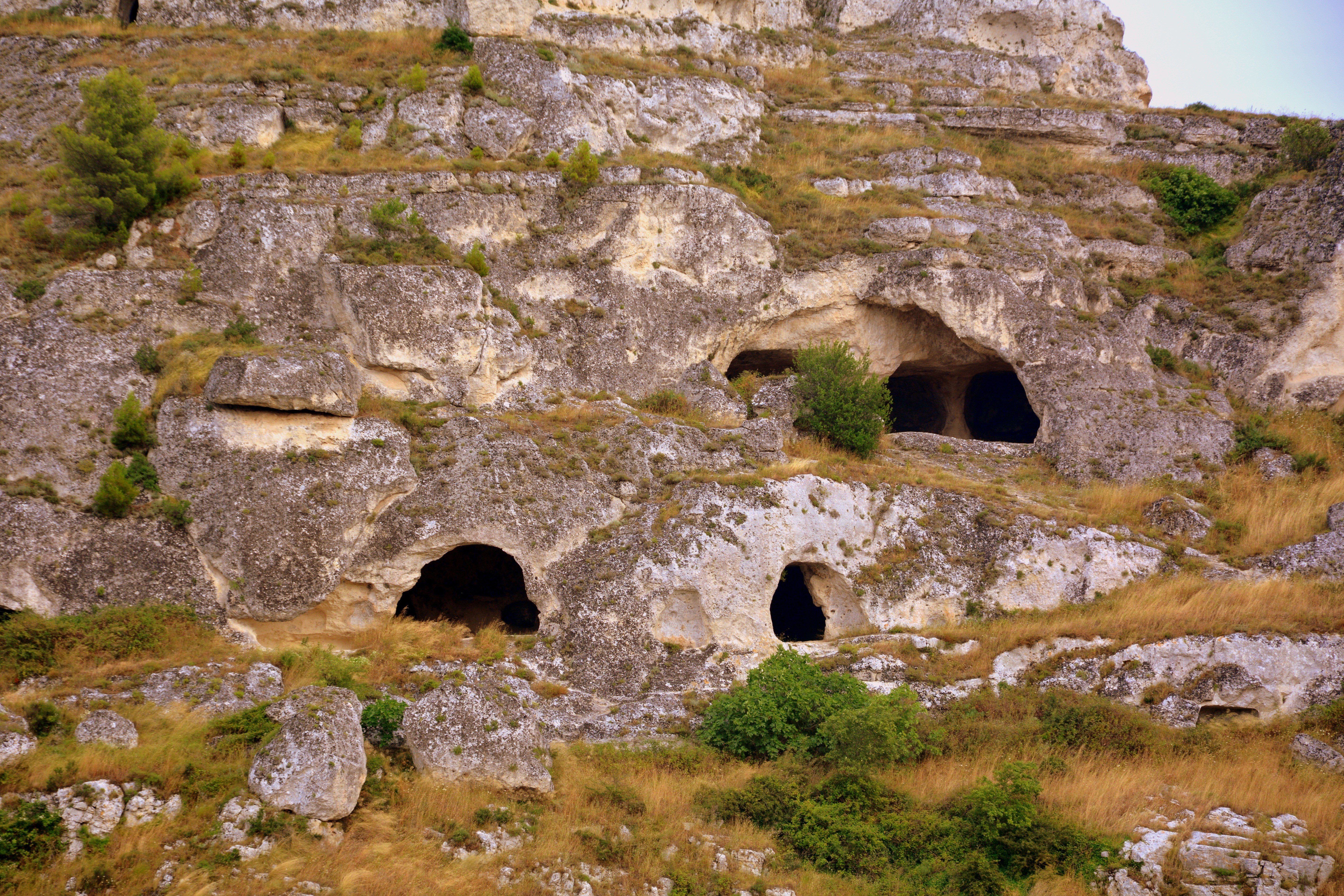 Caves in the rocky hills of Matera, Italy HD Wallpaper