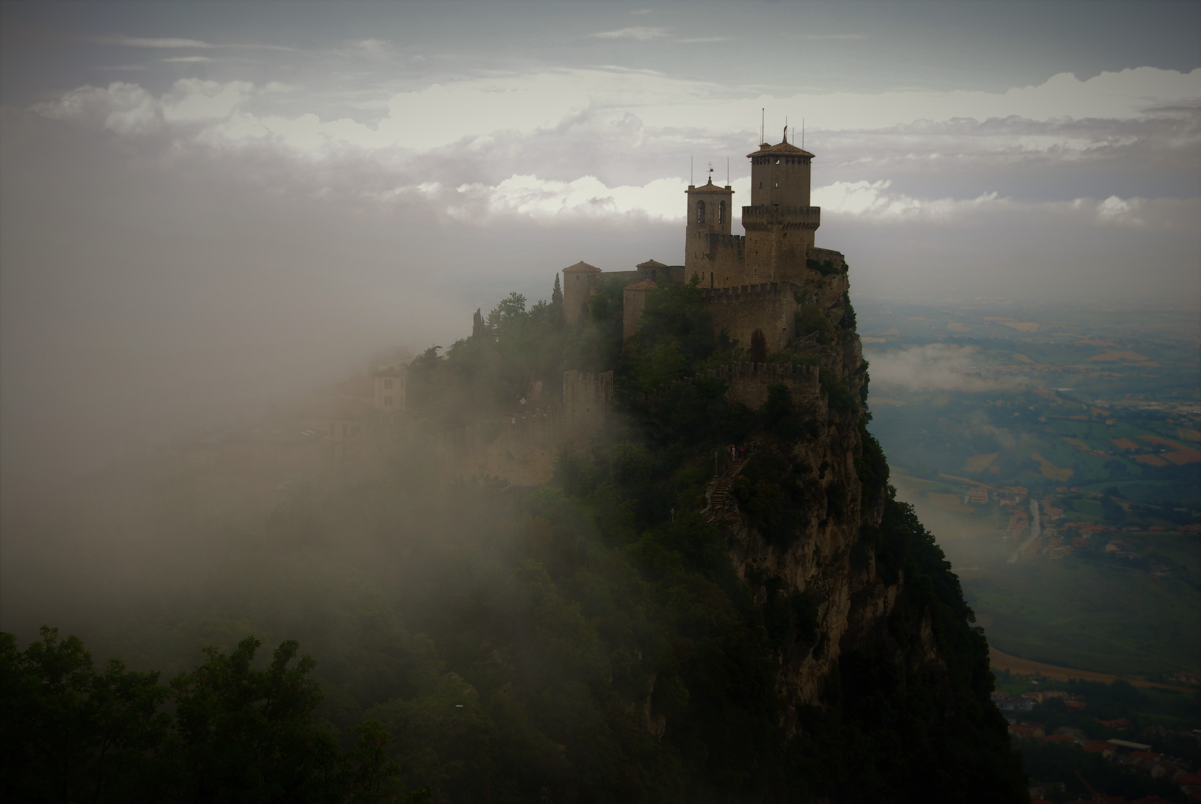 Castle on a cliff in San Marino with clouds HD Wallpaper