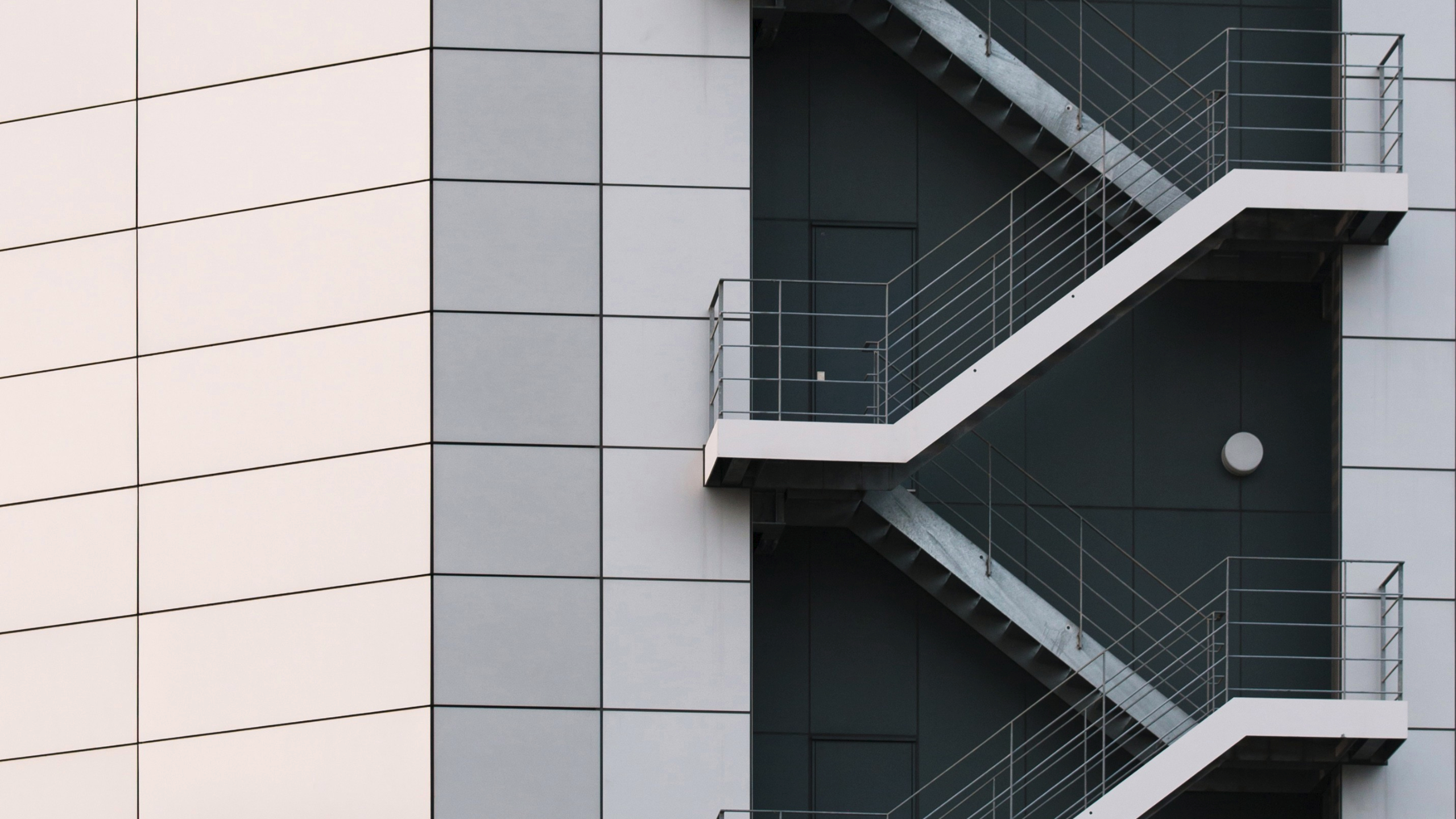 Modern building with external metal fire escape stairs HD Wallpaper